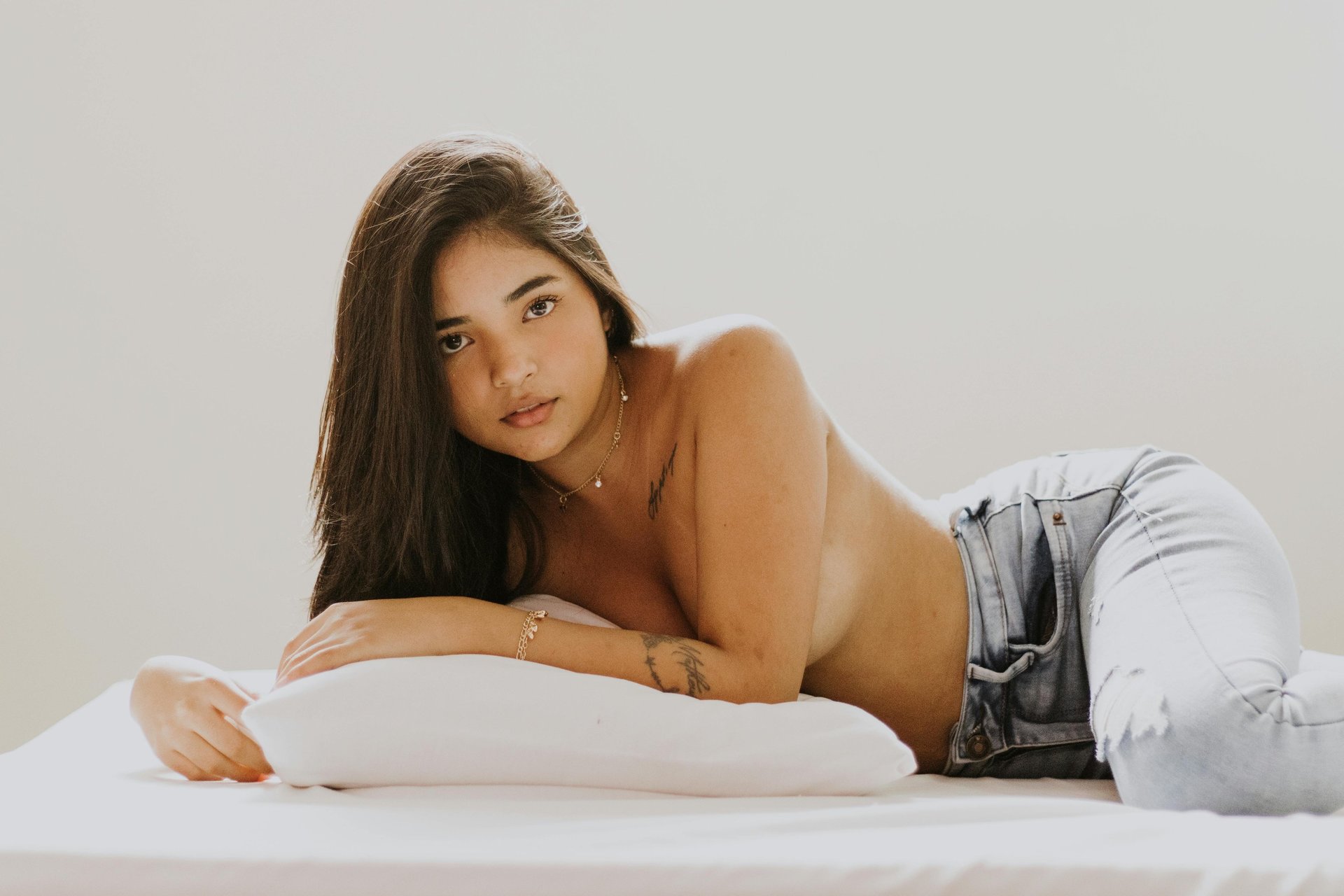 woman wearing yellow long-sleeved dress under white clouds and blue sky during daytime