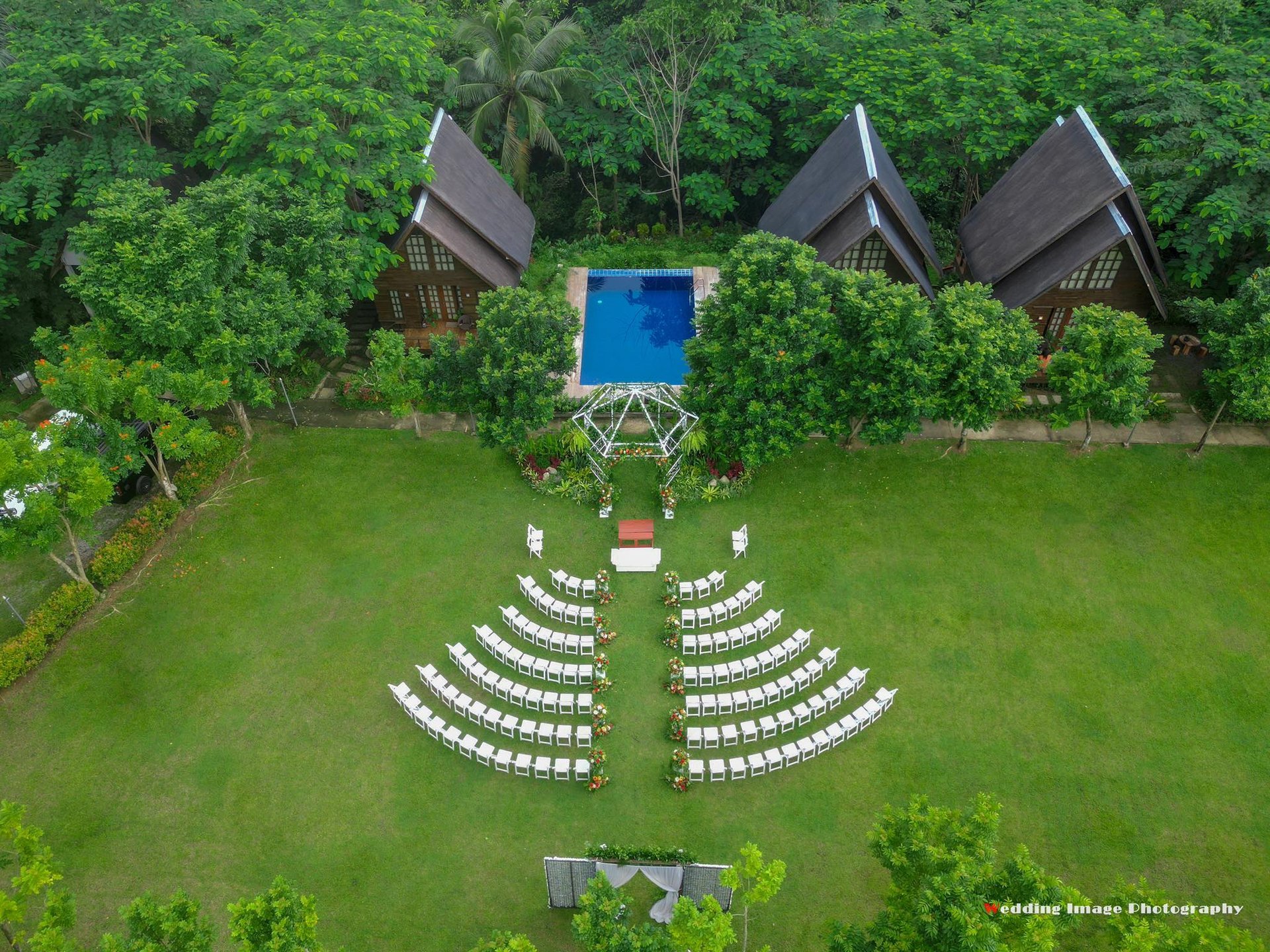 white folding chair in front of body of water