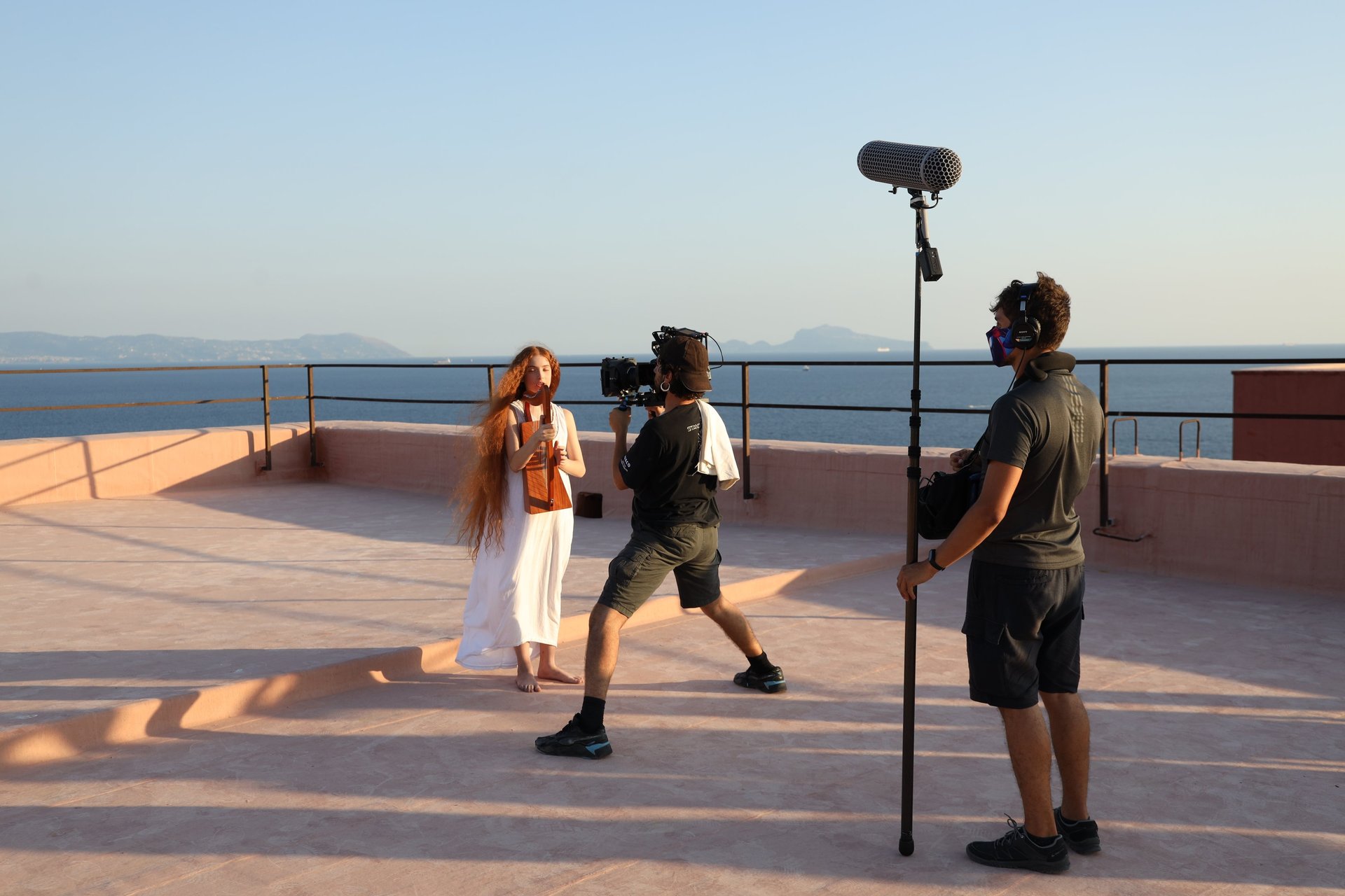 A tall building with windows and a sky background