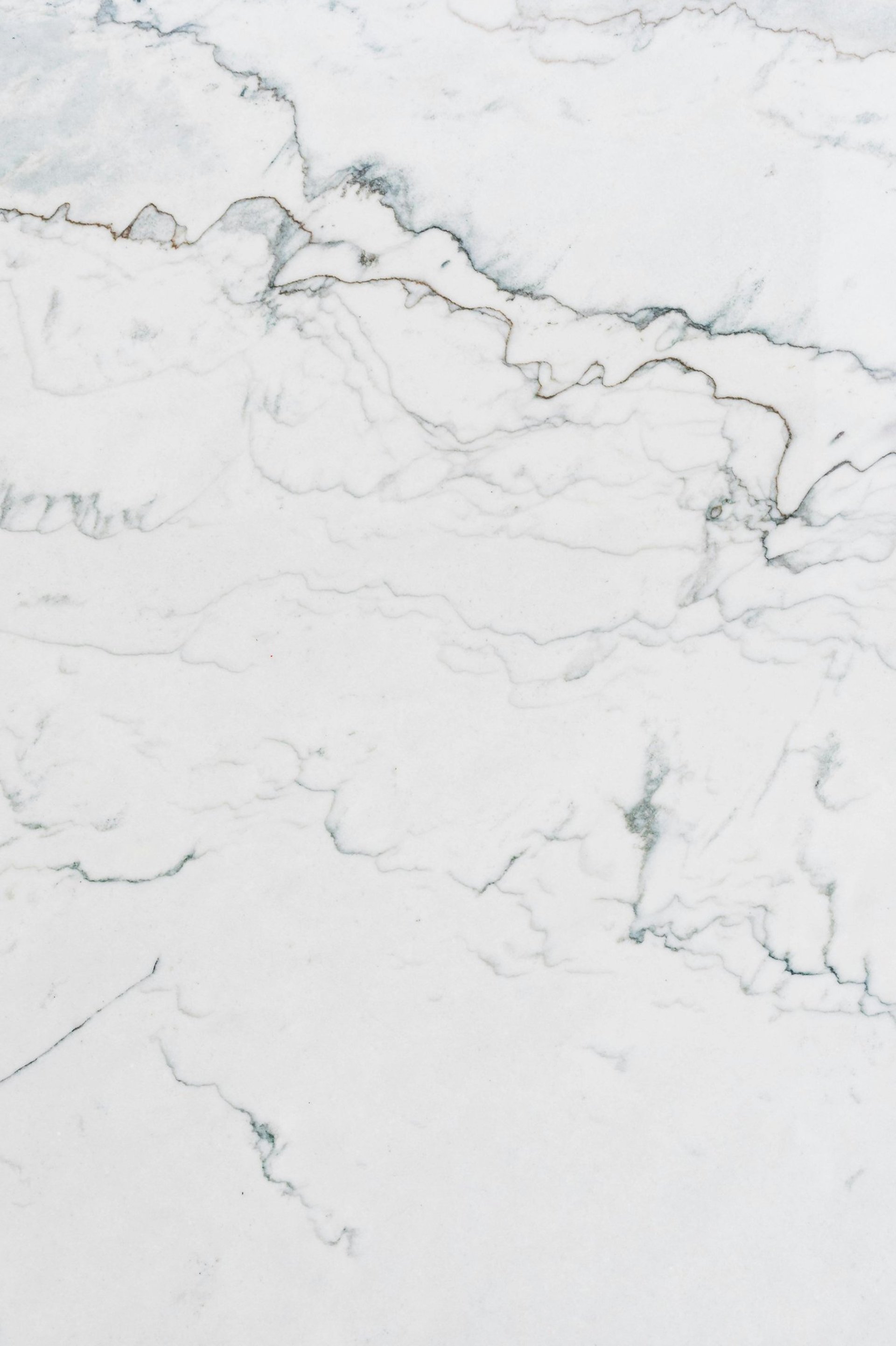 a close up of a white marble surface