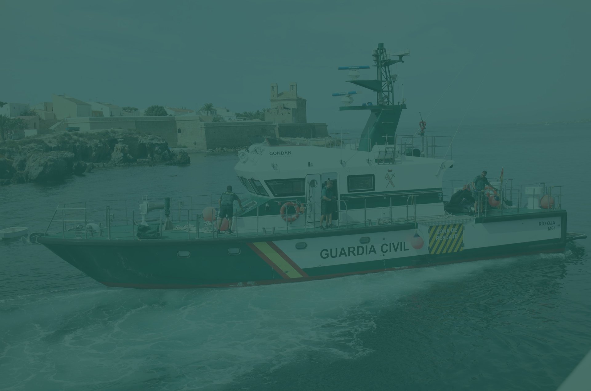 a large green and white boat in the water