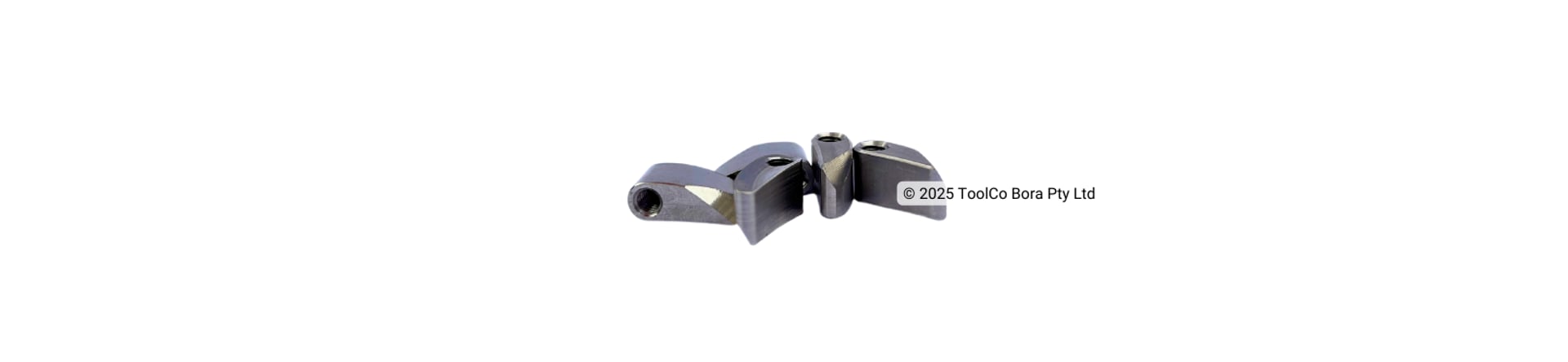 a group of small custom-made steel nuts on a white background
