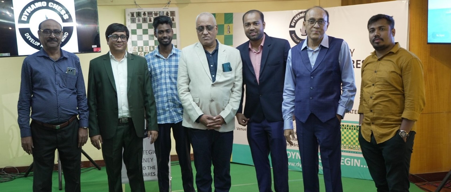 a man sitting on a couch in a lobby