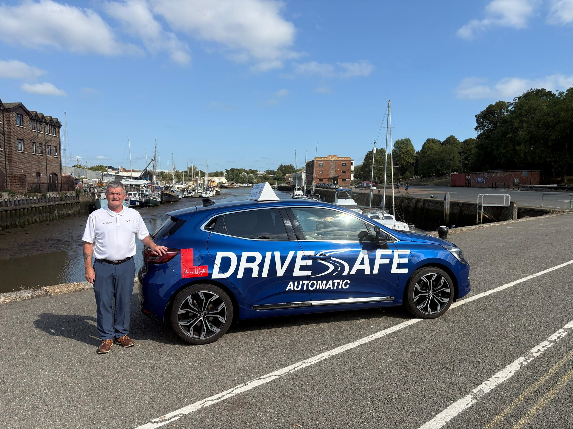 an abstract photo of a curved building with a blue sky in the background