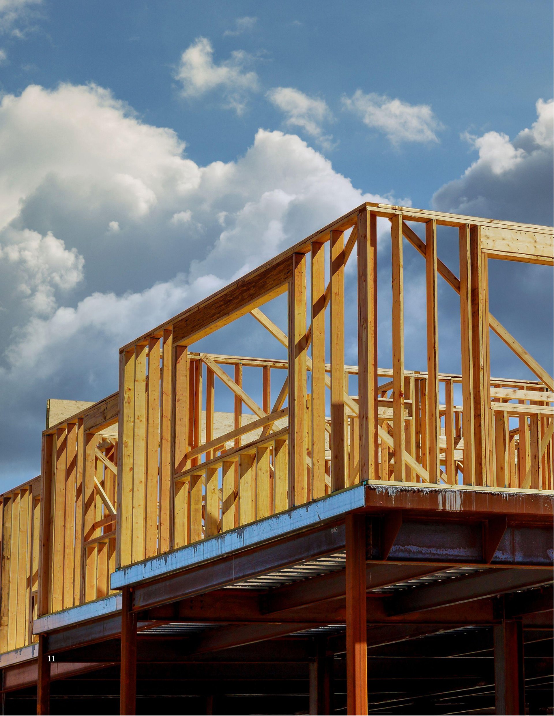 an abstract photo of a curved building with a blue sky in the background