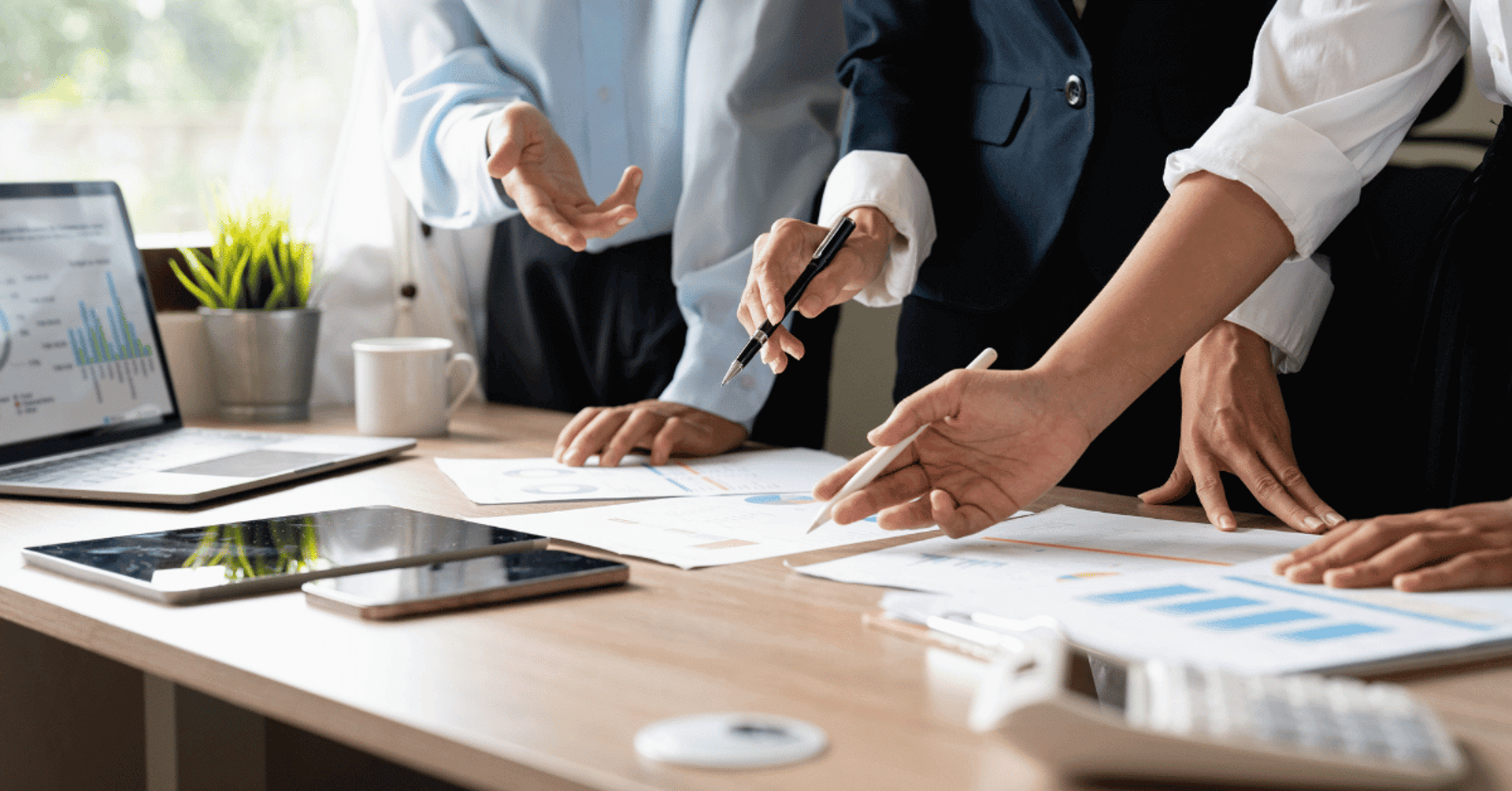 woman in gray and white striped long sleeve shirt using silver macbook