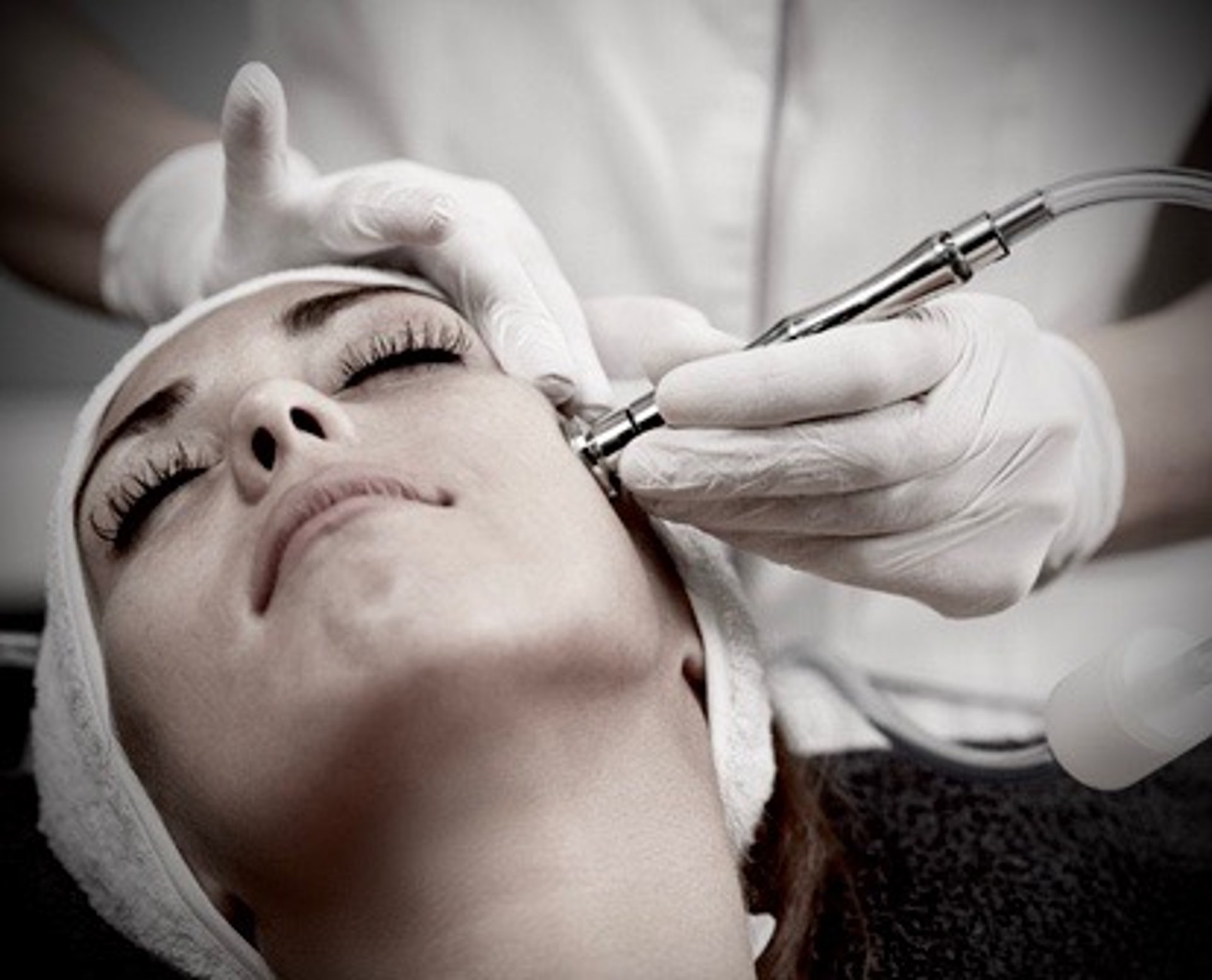 a woman laying in bed with steam coming out of her stomach