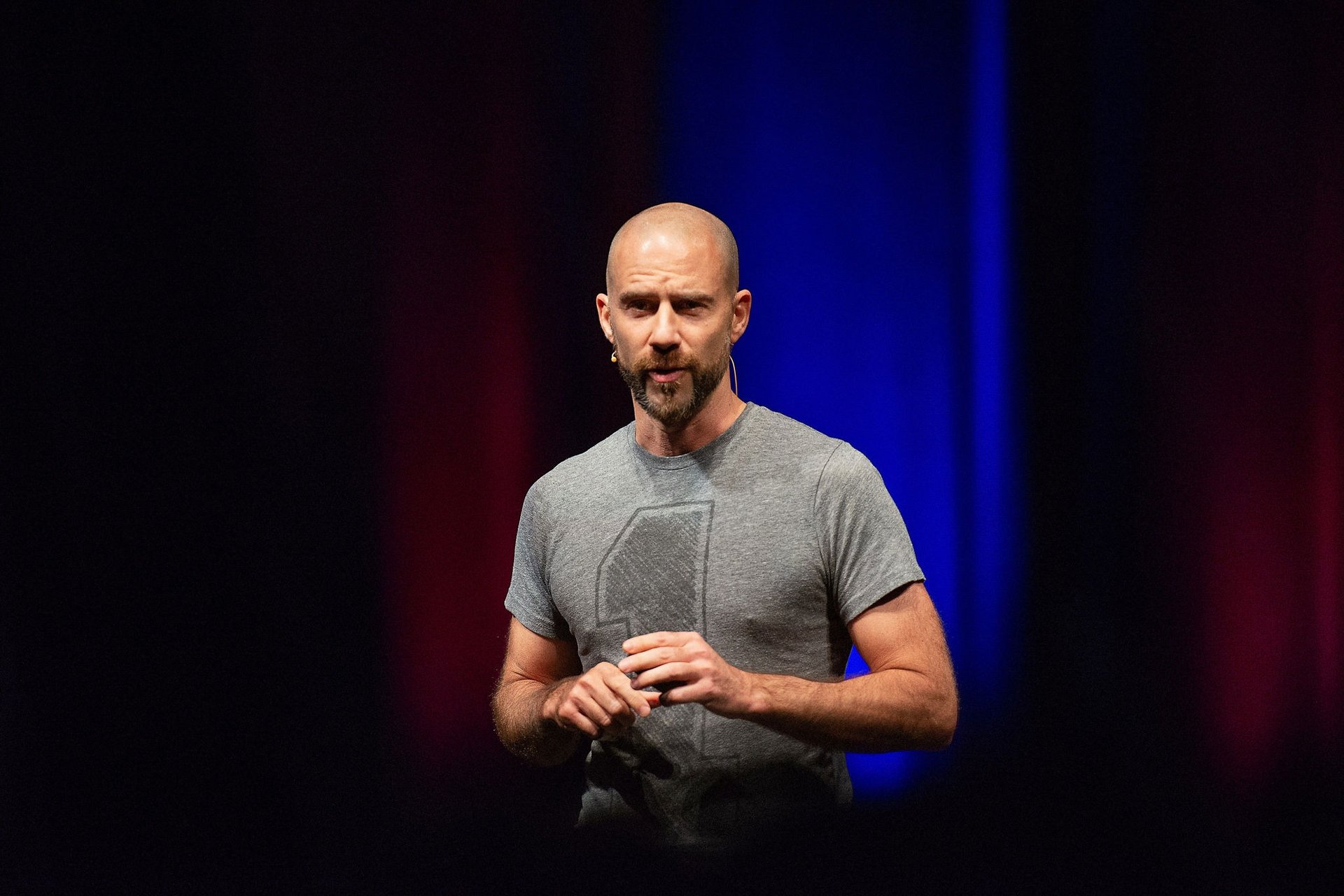 an abstract photo of a curved building with a blue sky in the background