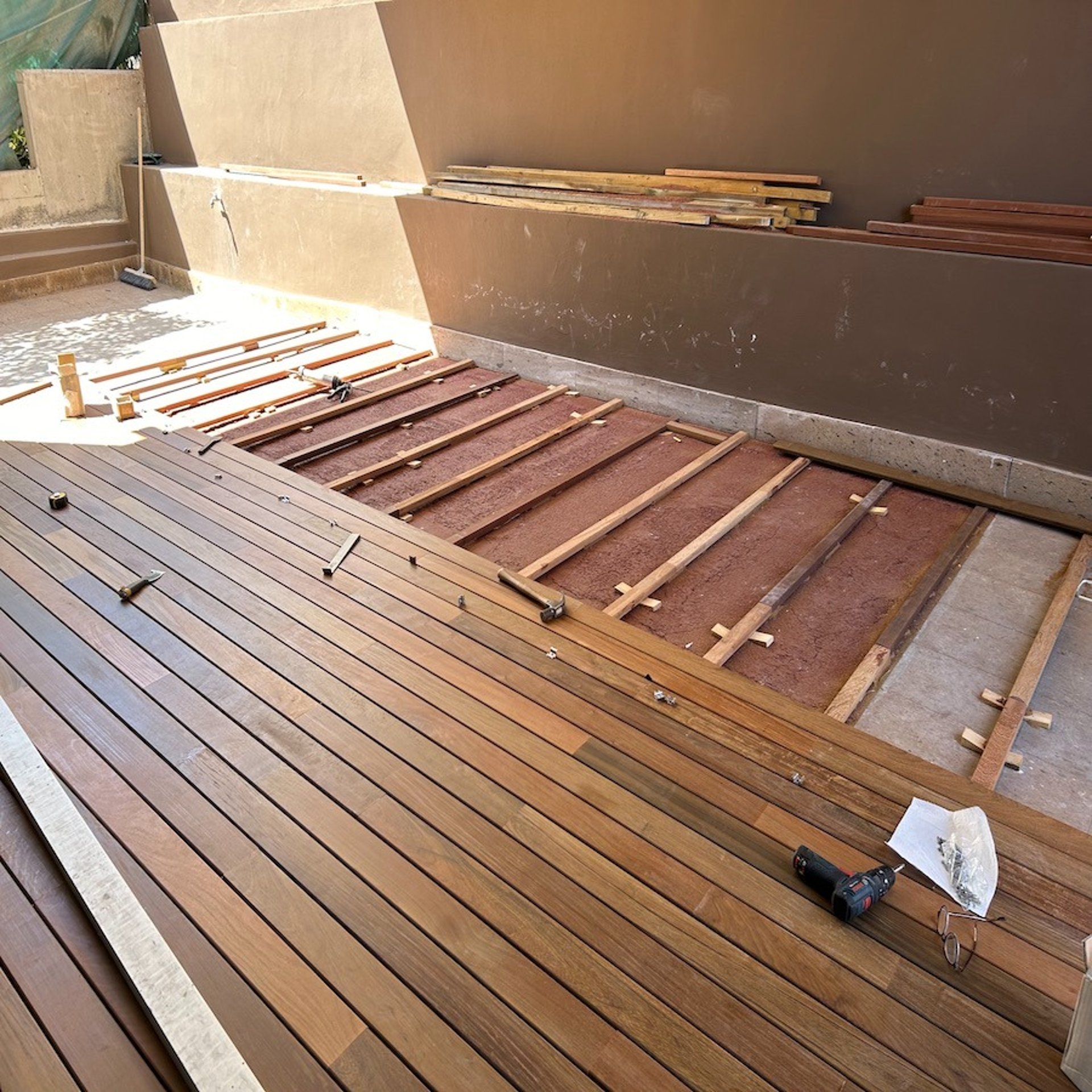 an abstract photo of a curved building with a blue sky in the background