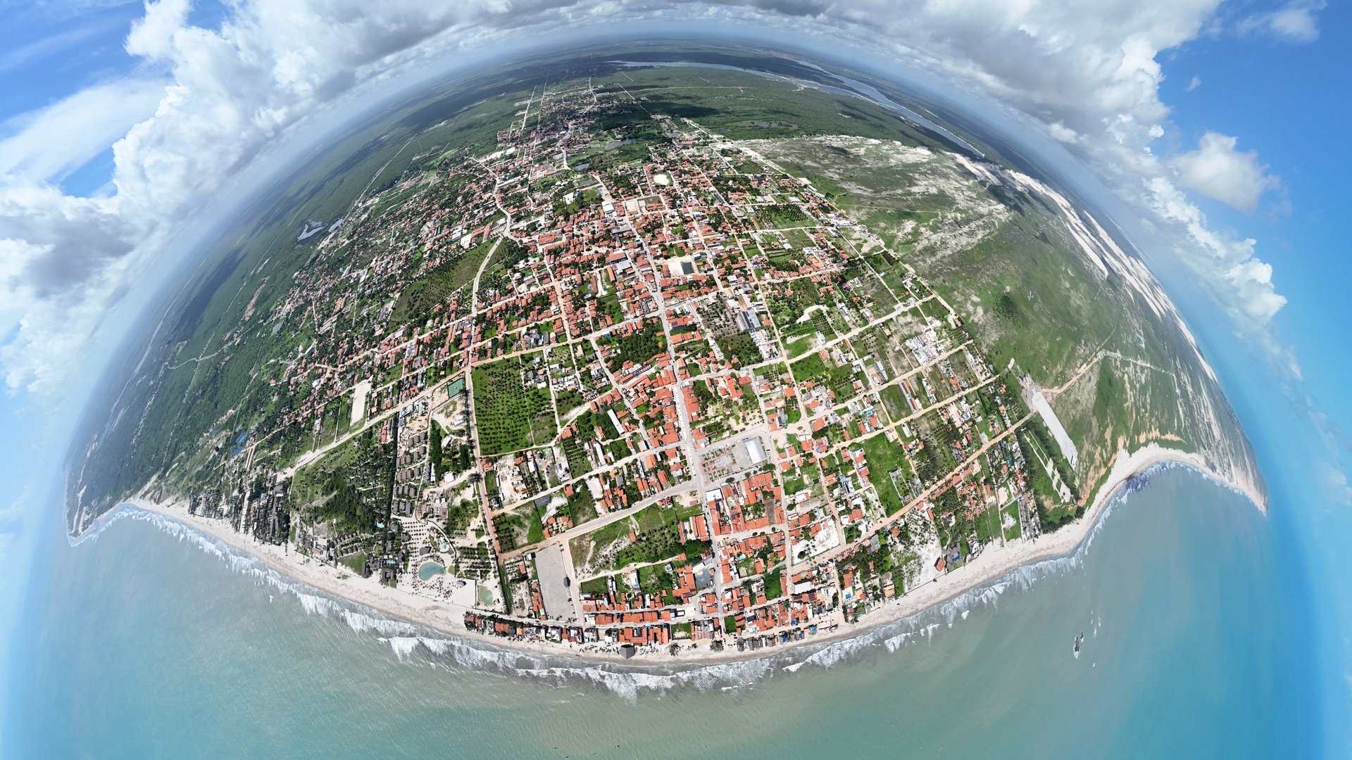 a small island in the middle of a blue sky