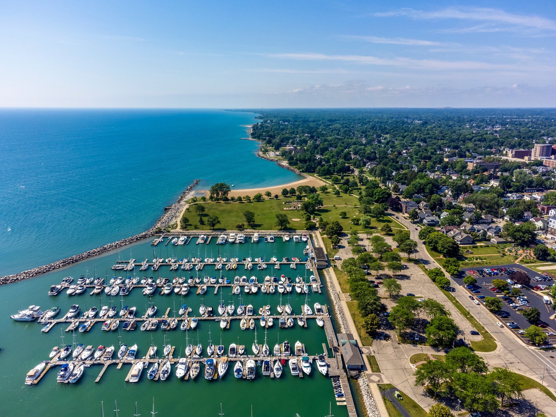 an abstract photo of a curved building with a blue sky in the background