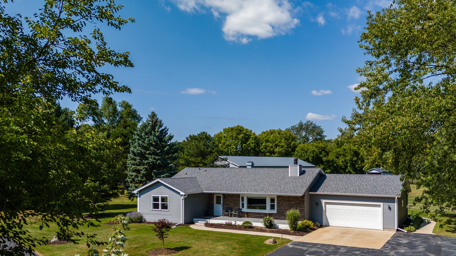 an abstract photo of a curved building with a blue sky in the background