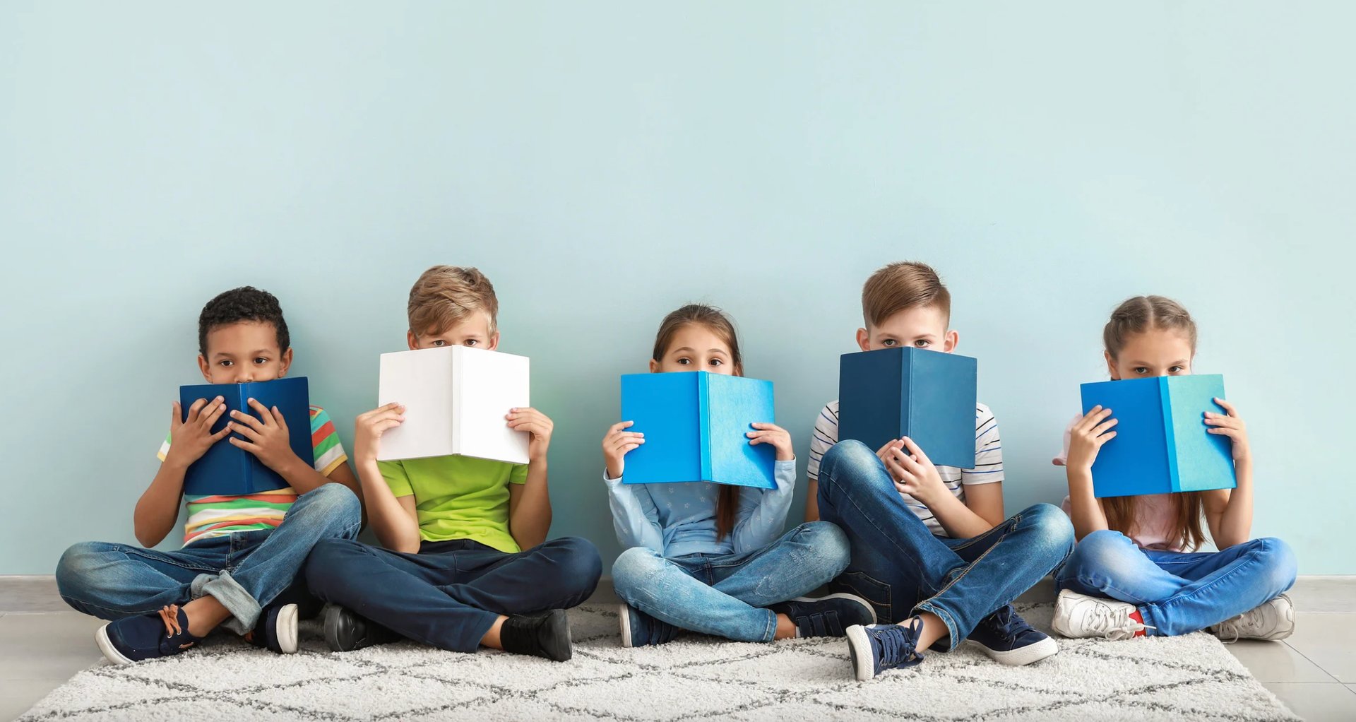 A close up of an open book with a black background