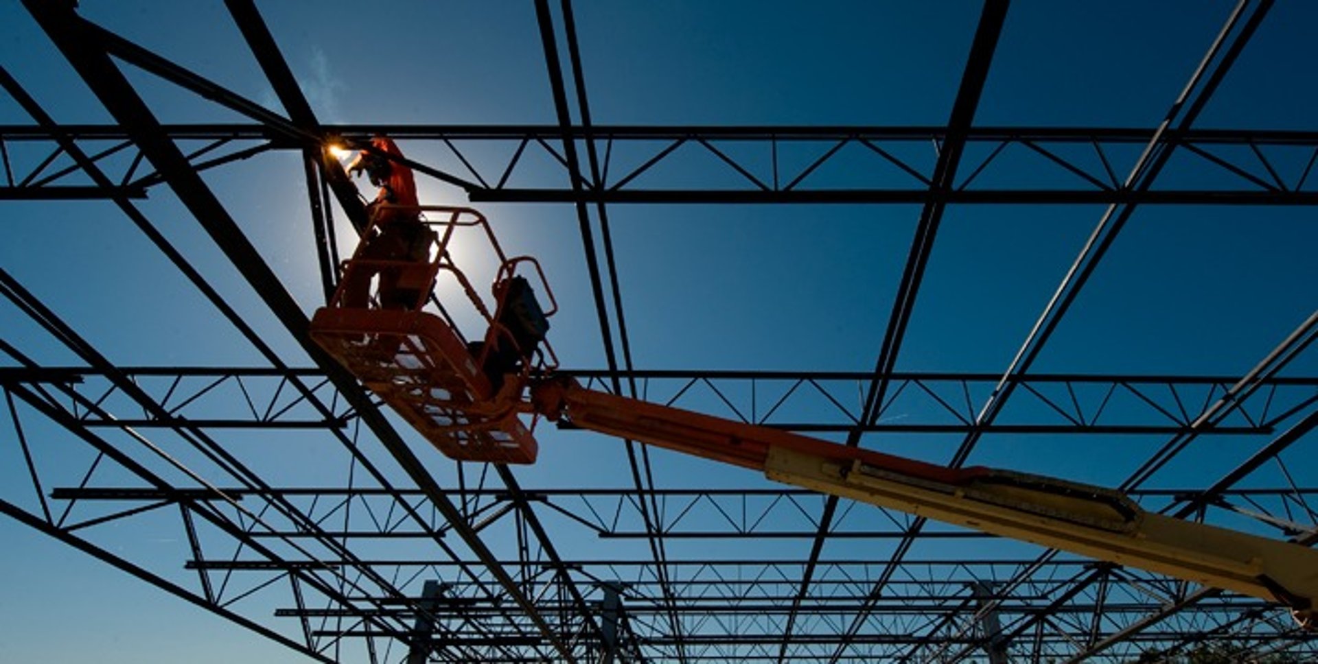 woman wearing yellow long-sleeved dress under white clouds and blue sky during daytime