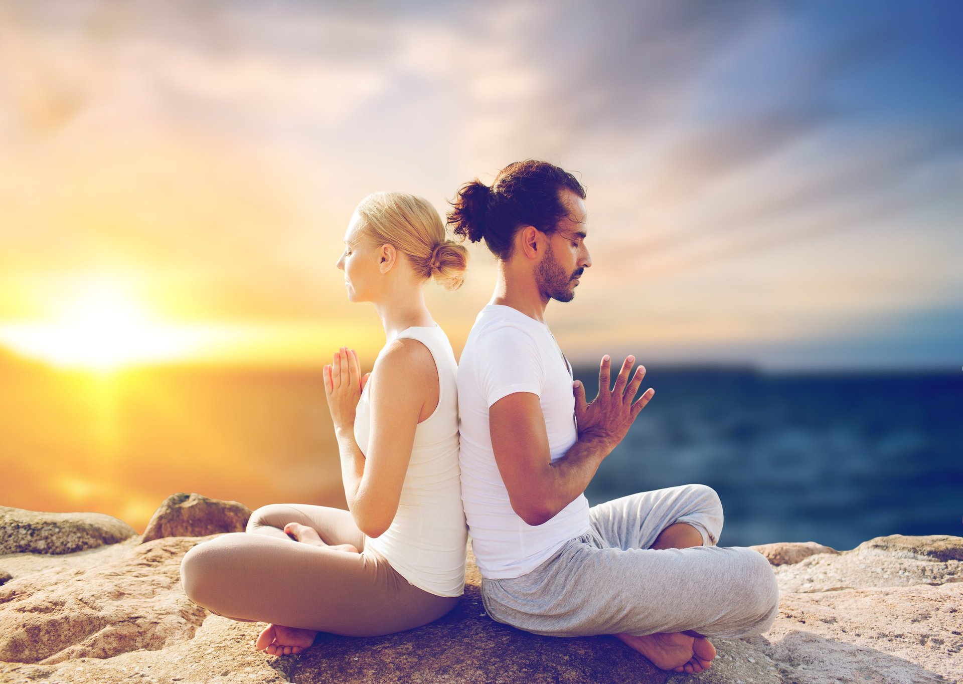 woman doing yoga meditation on brown parquet flooring
