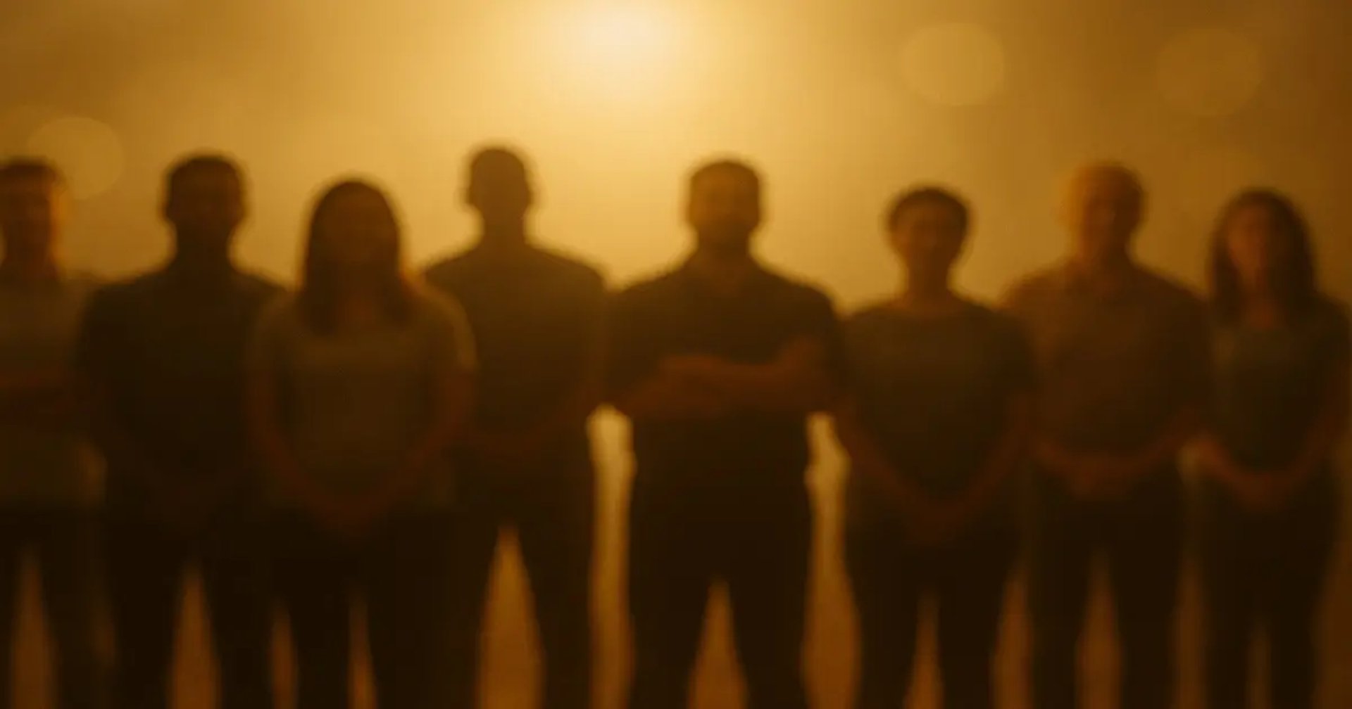Silhouetted group of people in golden light — representing unity, grace, and forgiveness for those once far from God