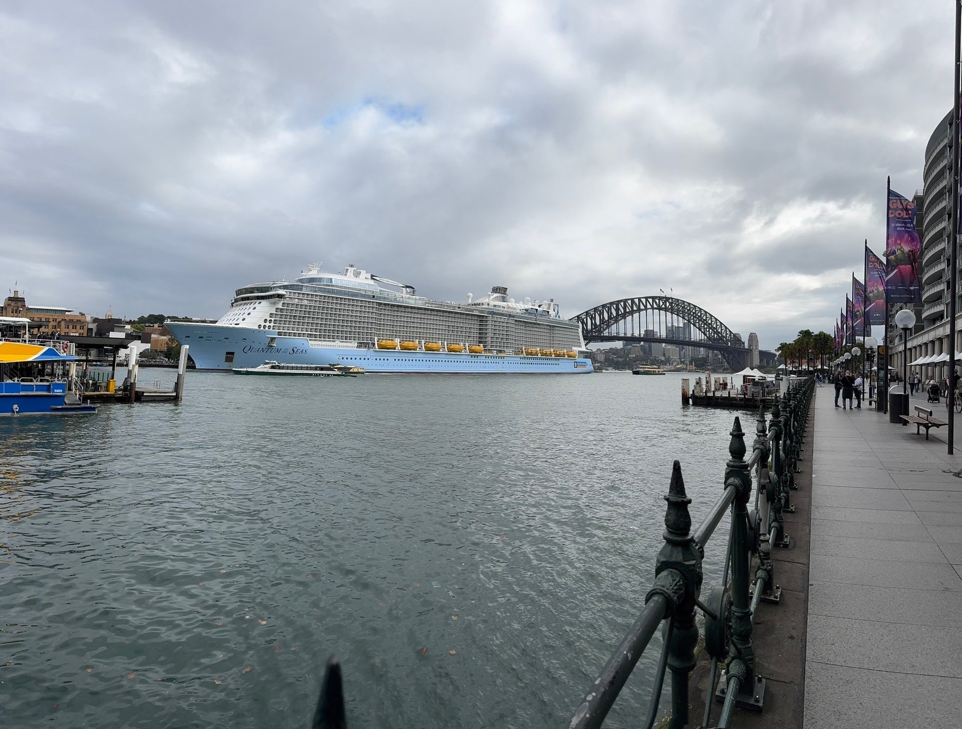 Darling Harbour Sydney with Royal Caribbean cruise ship docked by Sydney Harbour Bridge