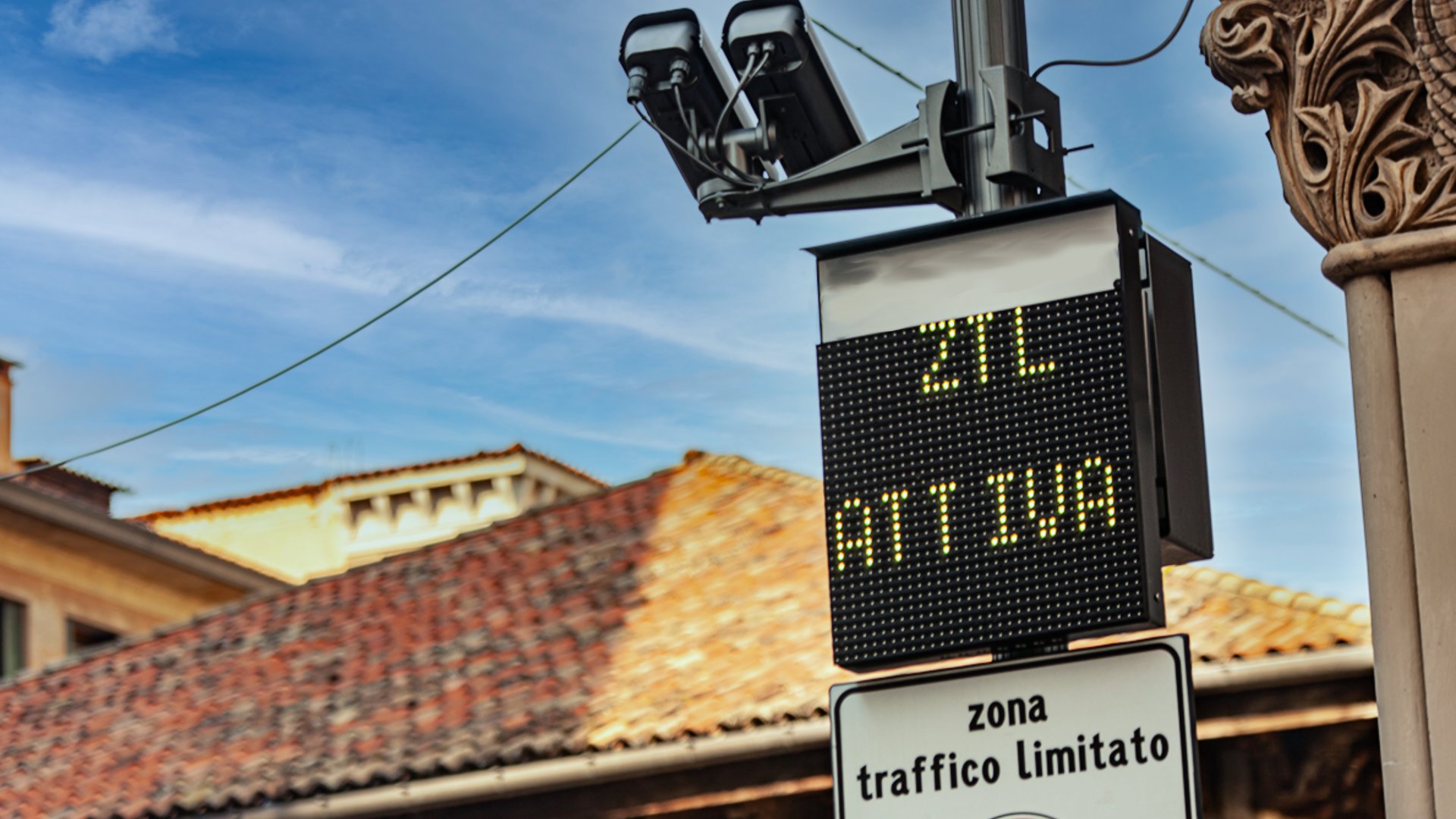 an abstract photo of a curved building with a blue sky in the background