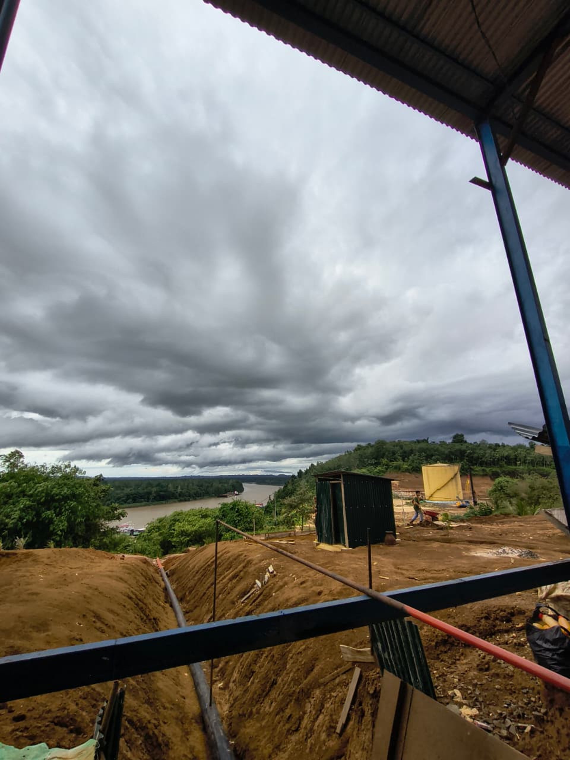 woman wearing yellow long-sleeved dress under white clouds and blue sky during daytime