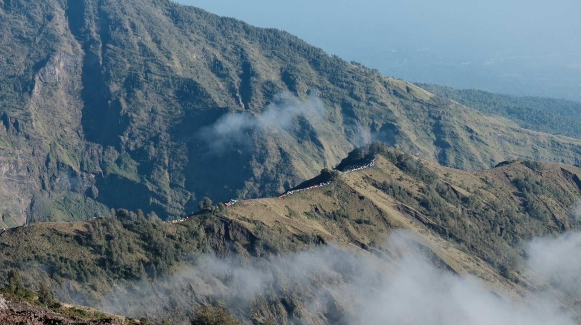 man walking on rock mountain