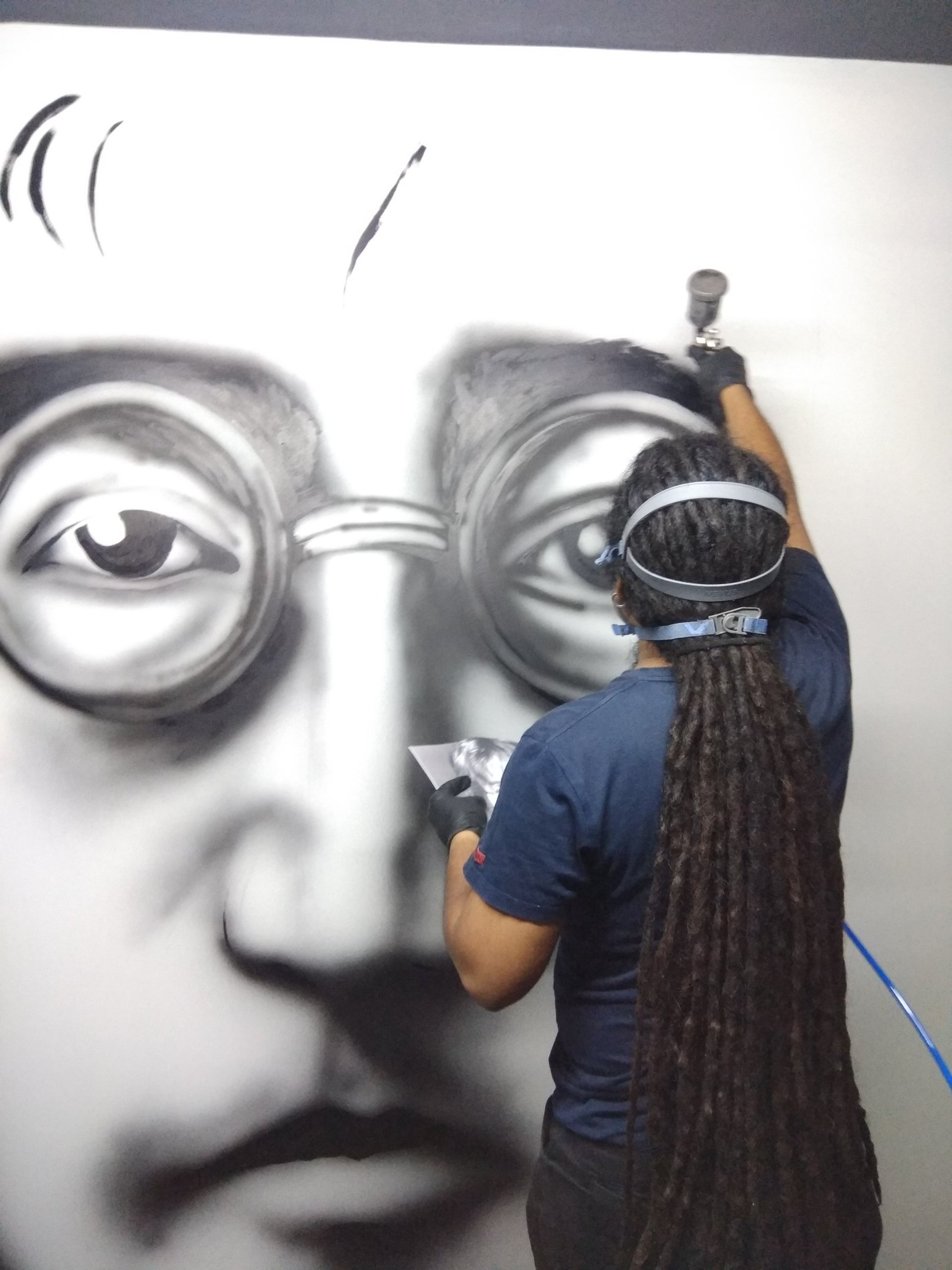 Close-up of a large, textured leaf with prominent veins.