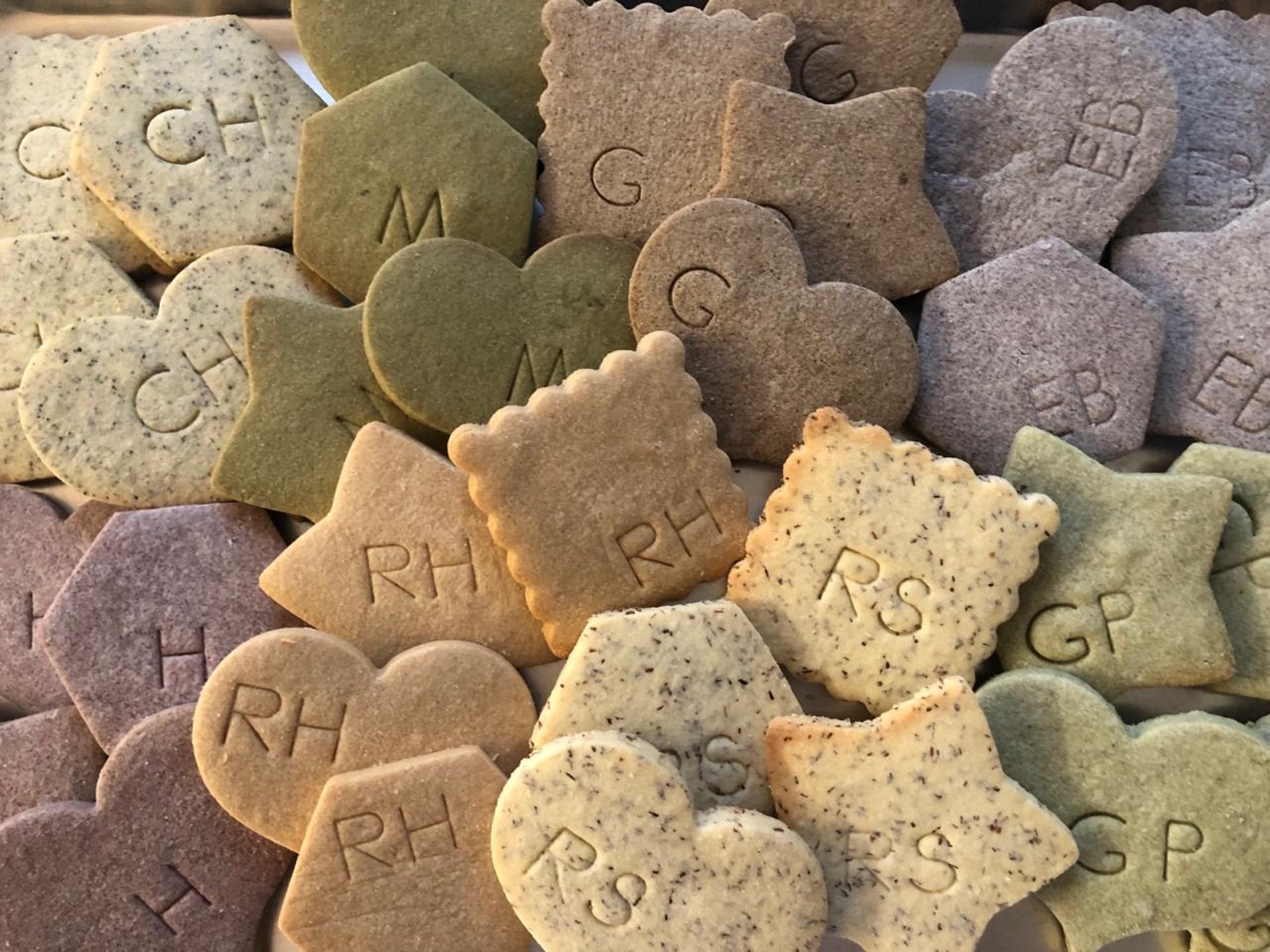 Freshly baked gourmet cookies in unique flavors coffee, chocolate, matcha, bee pollen, and hibiscus