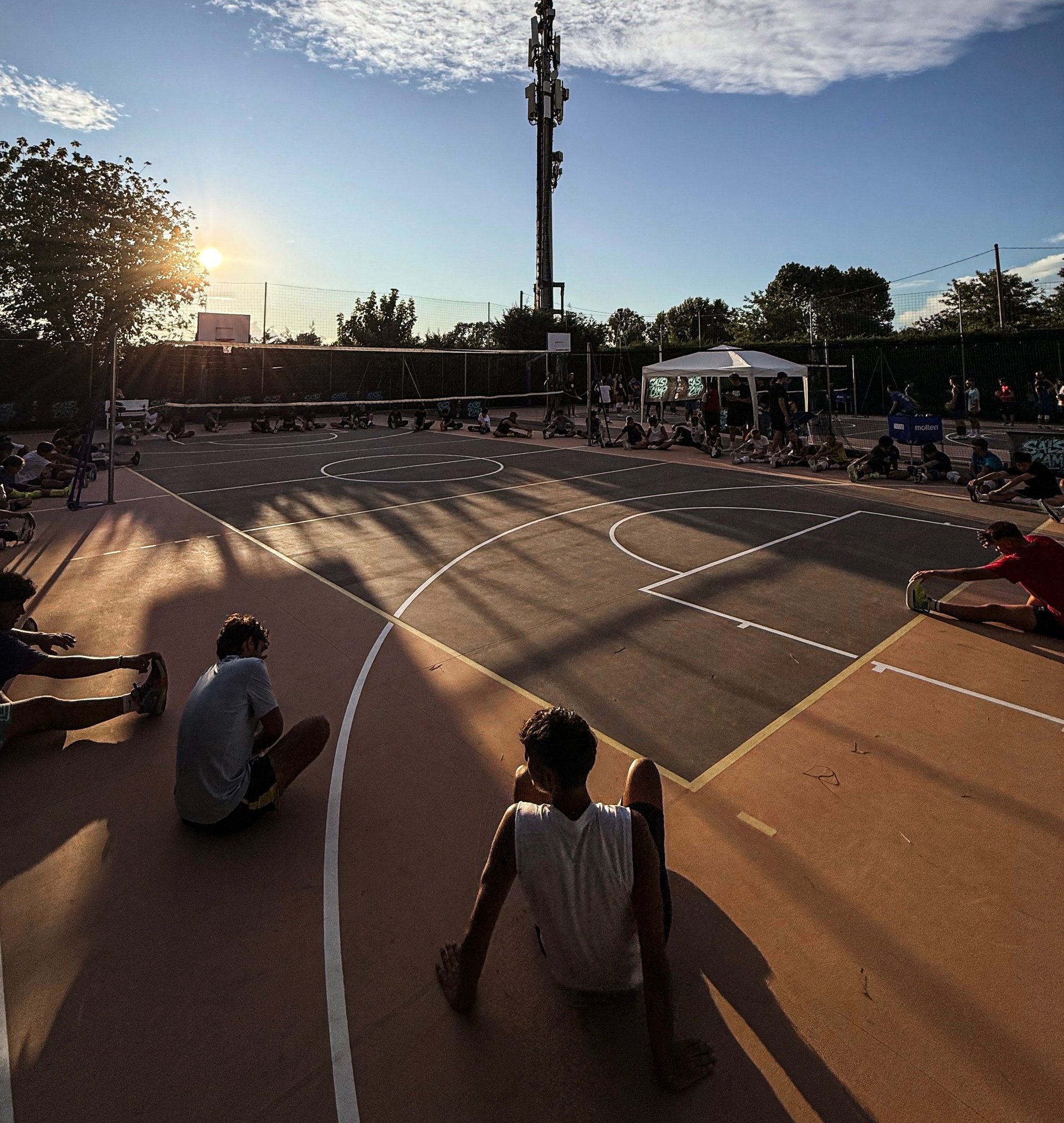 an abstract photo of a curved building with a blue sky in the background