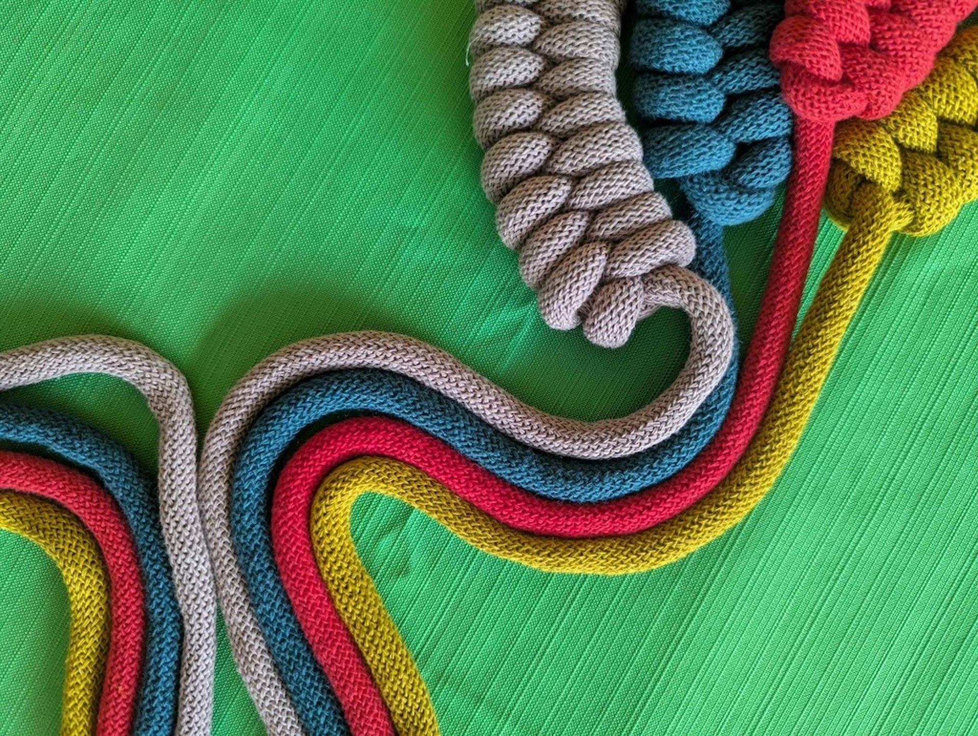 an abstract photo of a curved building with a blue sky in the background