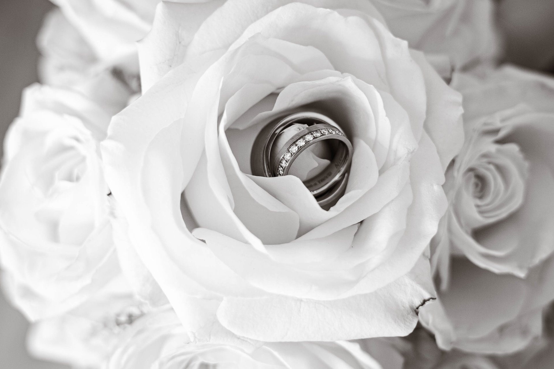 groom beside bride holding bouquet flowers