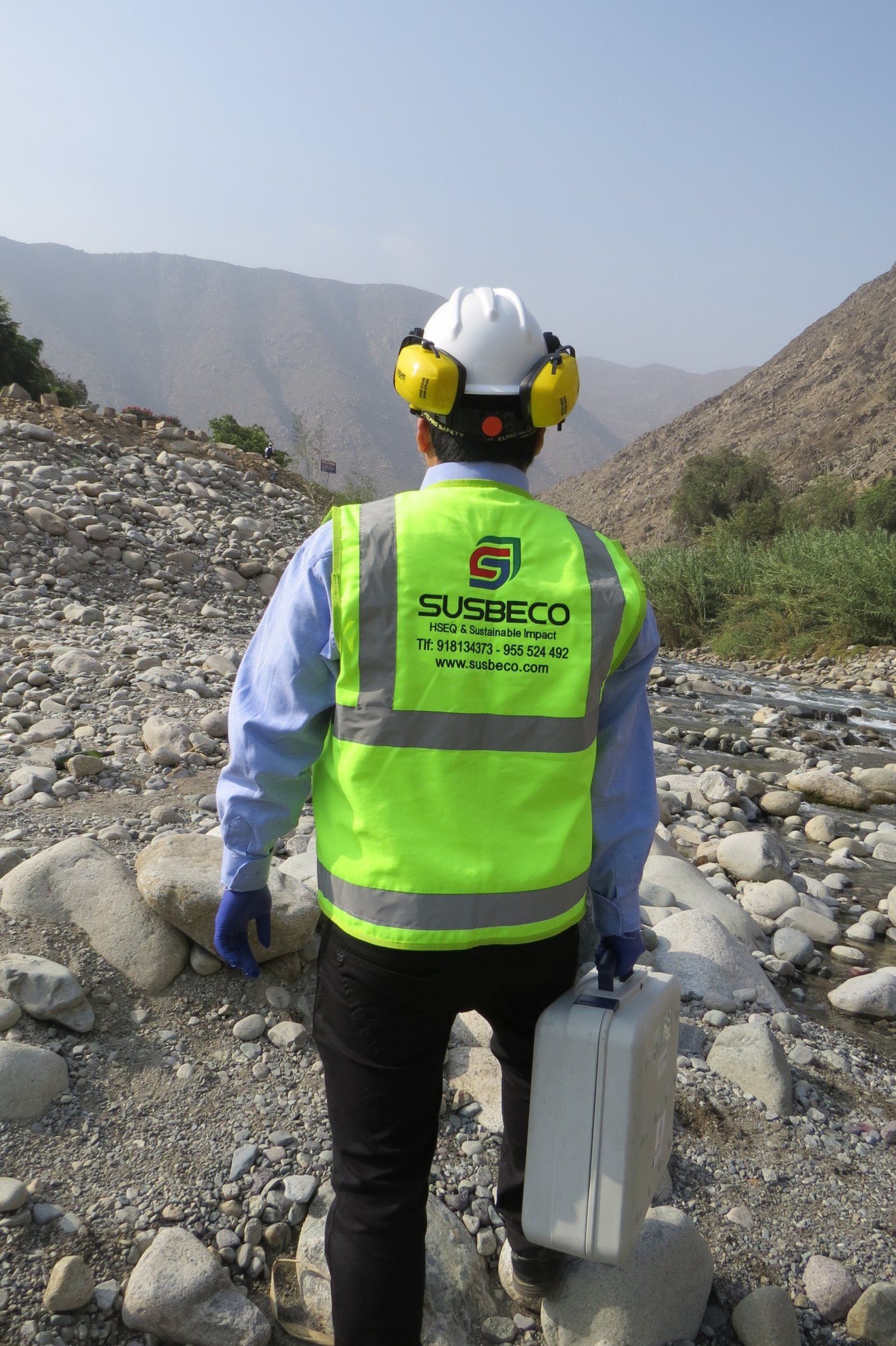 an abstract photo of a curved building with a blue sky in the background