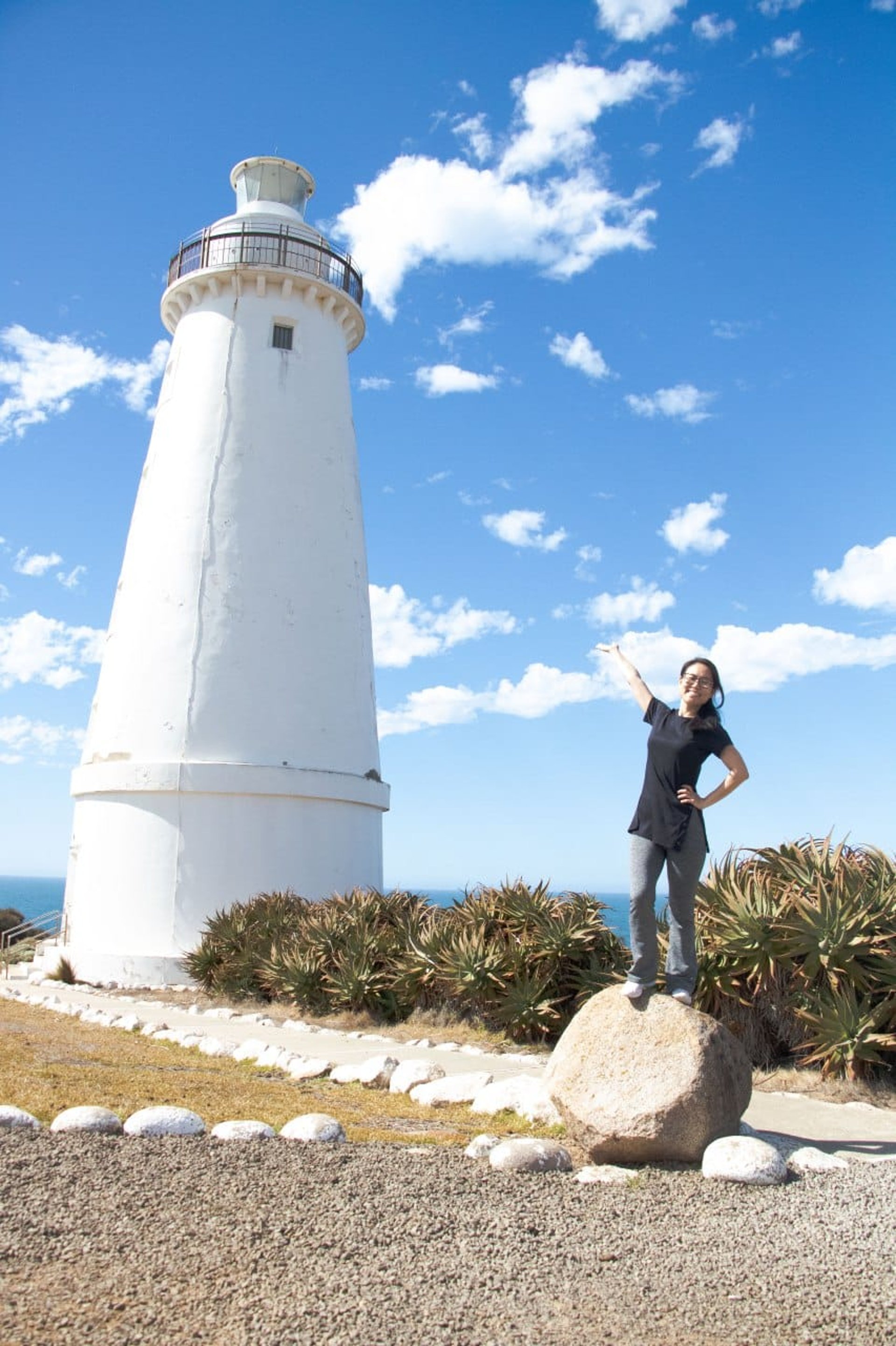 woman wearing yellow long-sleeved dress under white clouds and blue sky during daytime