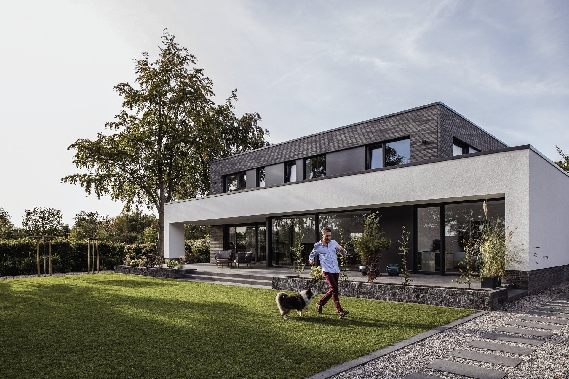 woman wearing yellow long-sleeved dress under white clouds and blue sky during daytime