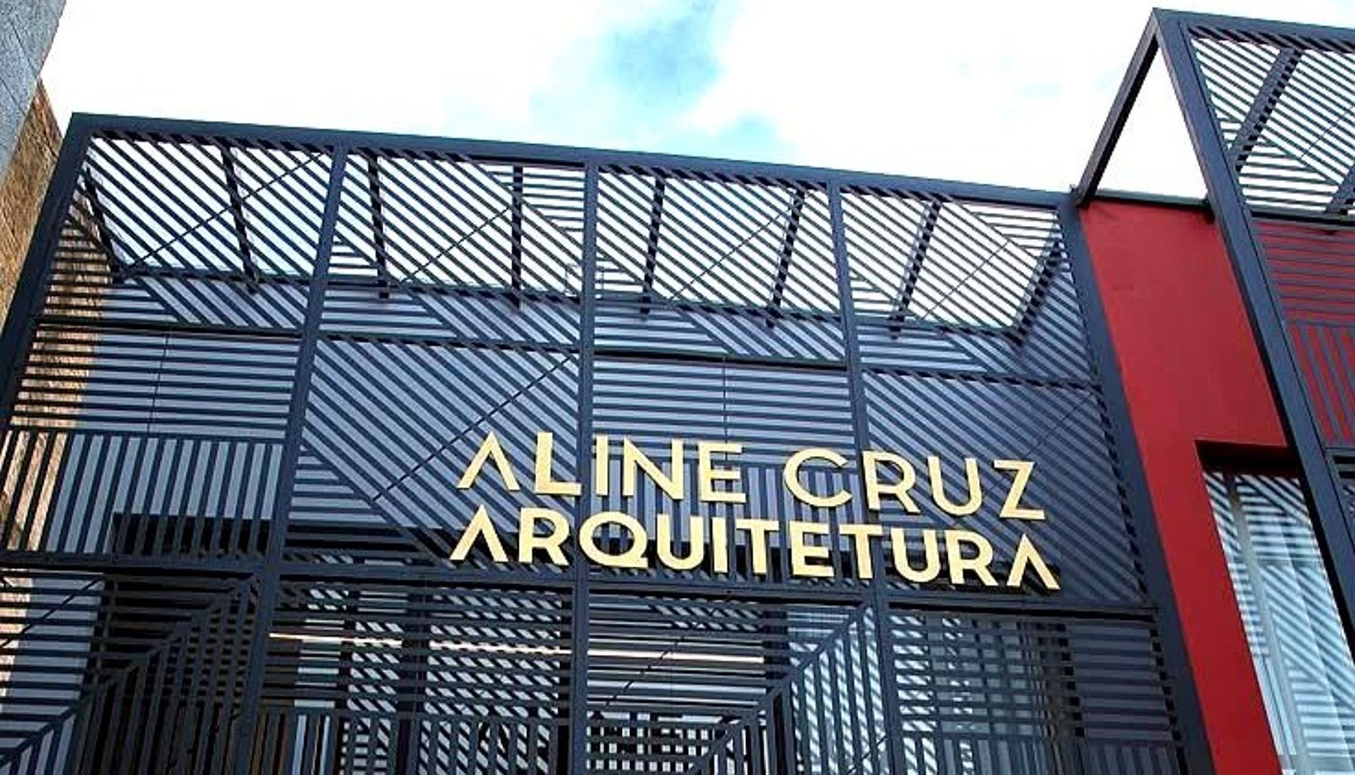 an abstract photo of a curved building with a blue sky in the background