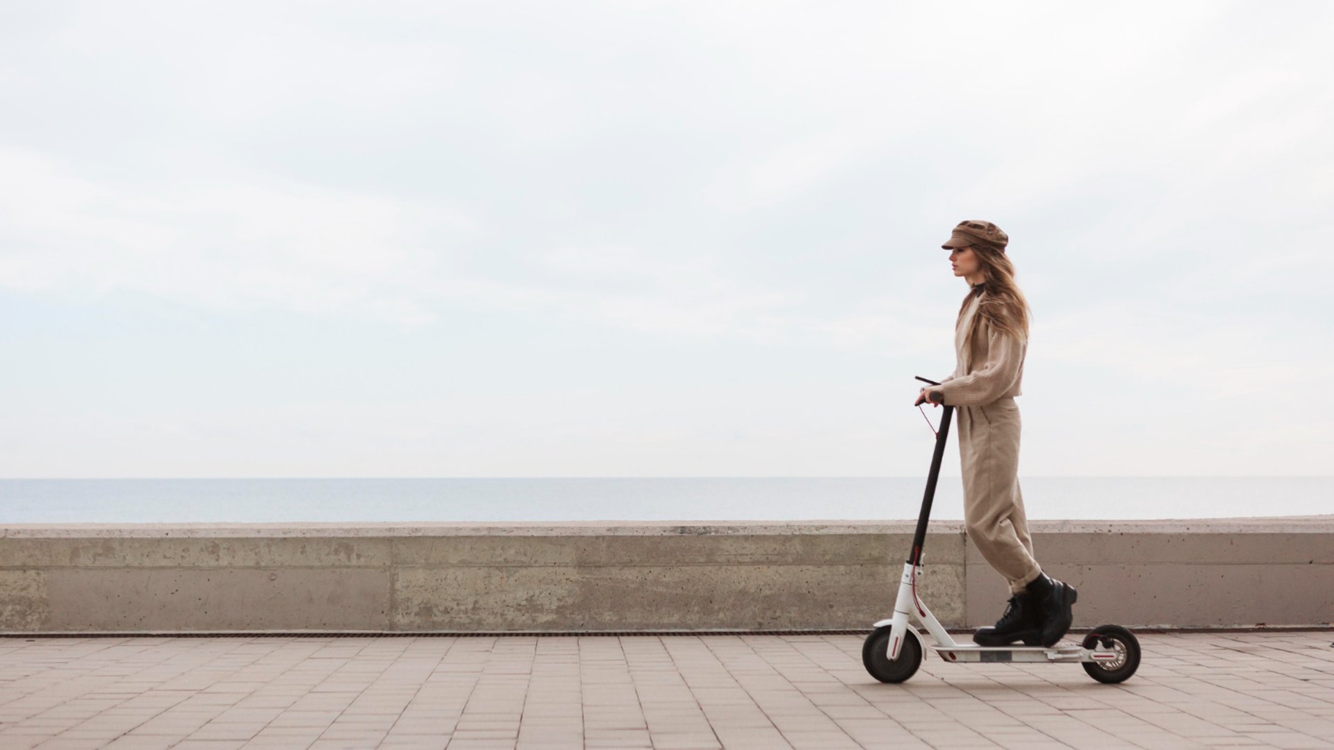 people walking on sidewalk near high rise buildings during daytime
