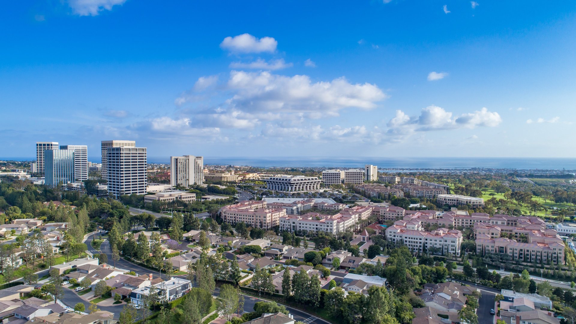 Aerial view of Newport Center and coastal Orange County, showcasing upscale residential neighborhoods and commercial towers
