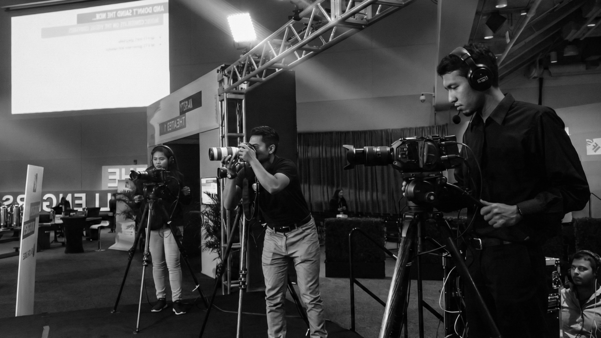 a group of people standing in a dark room