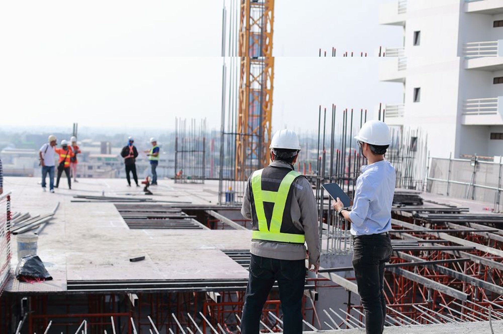 a couple of tall buildings sitting next to each other