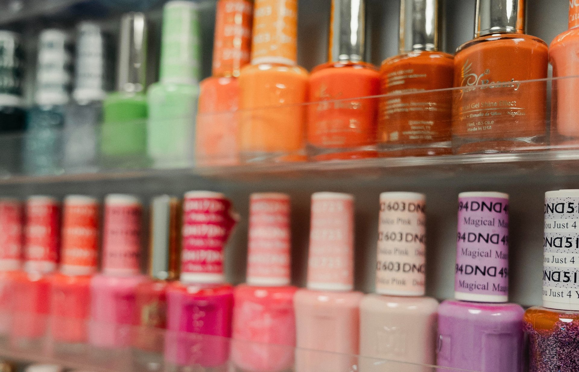 white and black bottles on brown wooden shelf