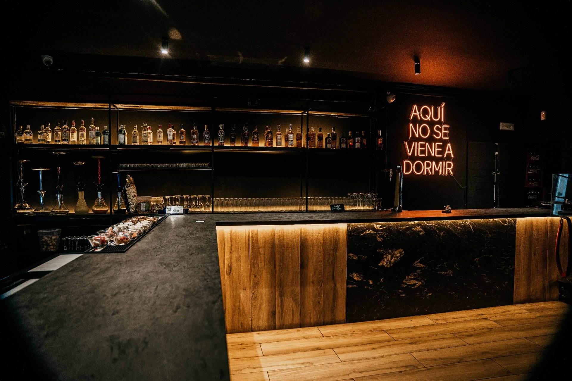 an abstract photo of a curved building with a blue sky in the background