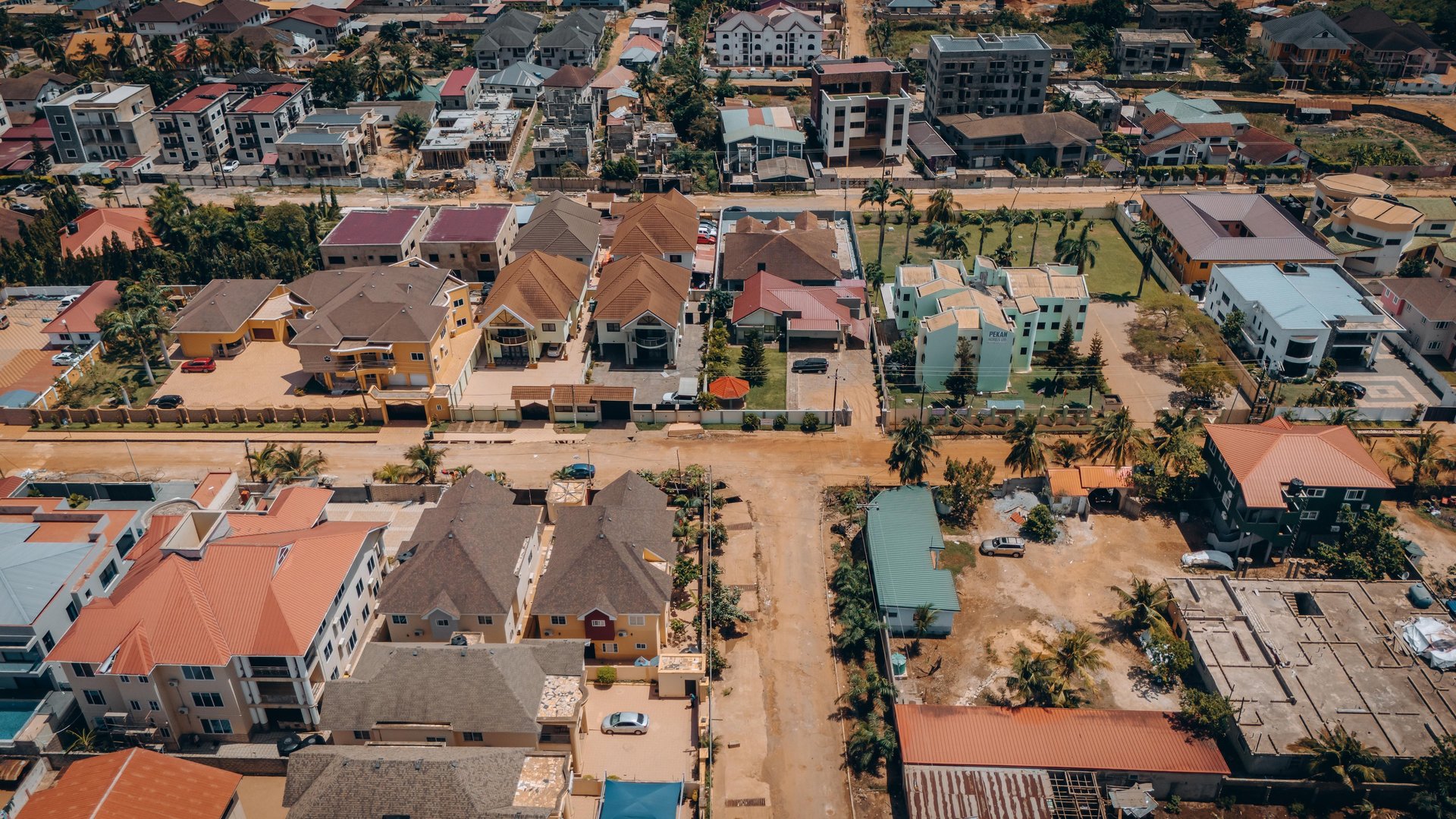 woman wearing yellow long-sleeved dress under white clouds and blue sky during daytime