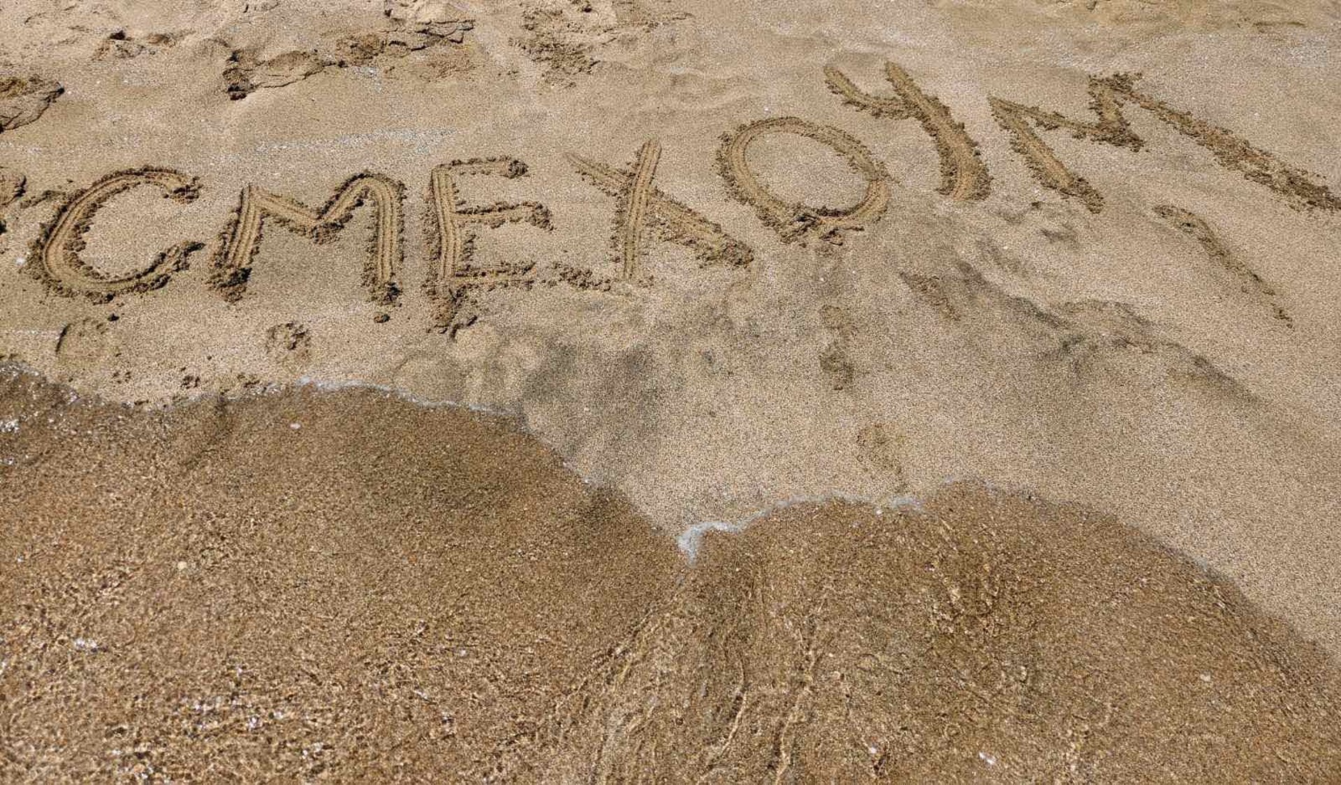 A group of green chairs sitting next to each other