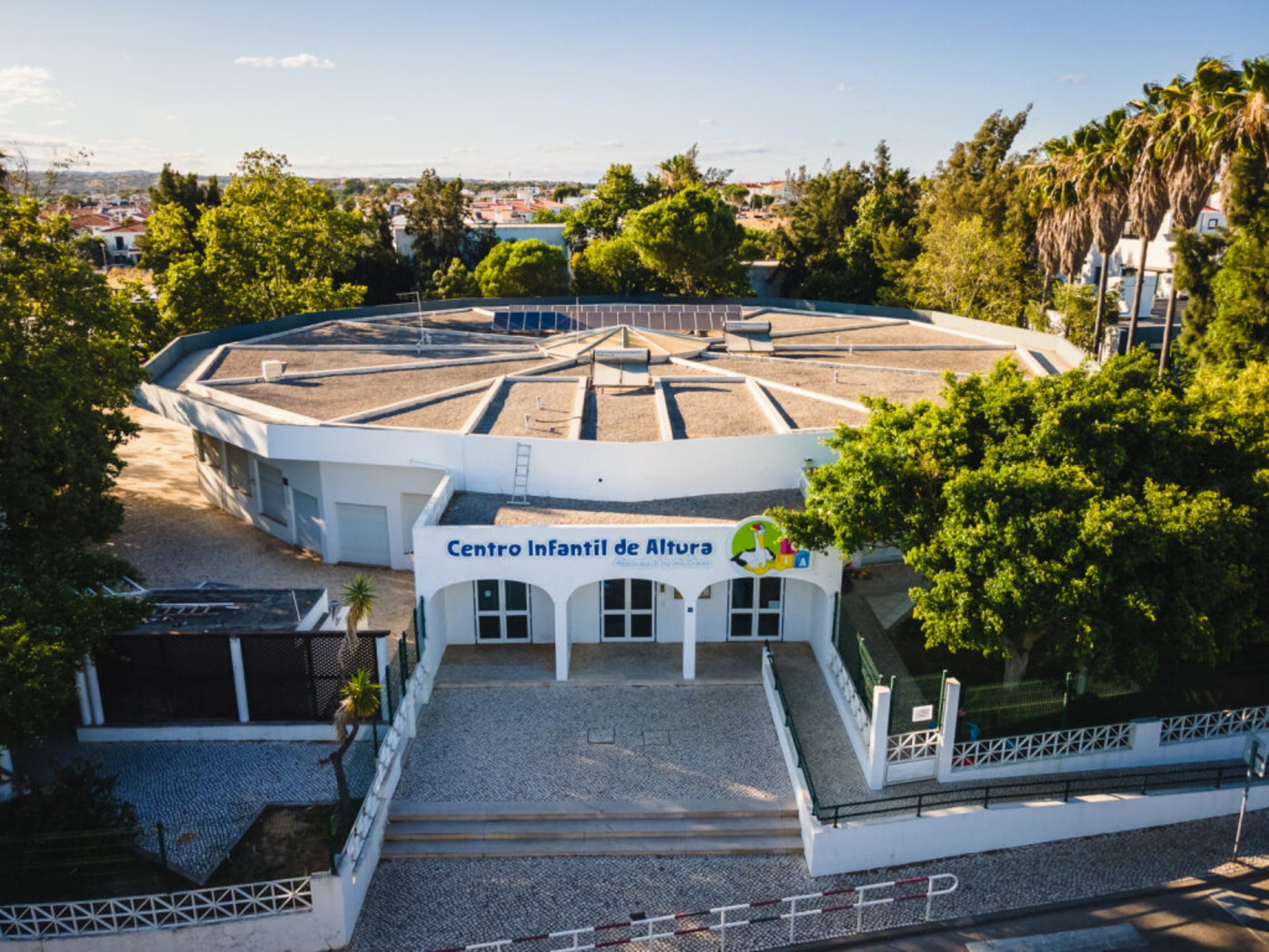 an abstract photo of a curved building with a blue sky in the background