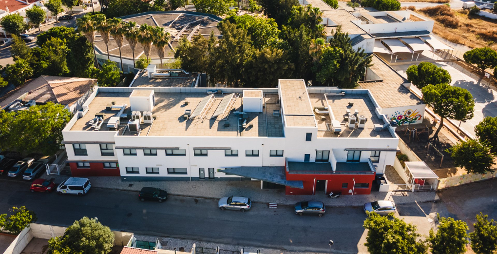 an abstract photo of a curved building with a blue sky in the background
