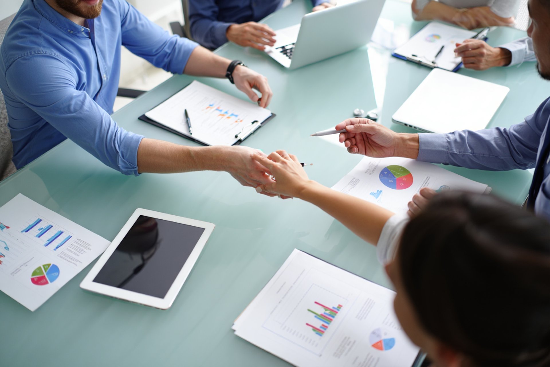an abstract photo of a curved building with a blue sky in the background