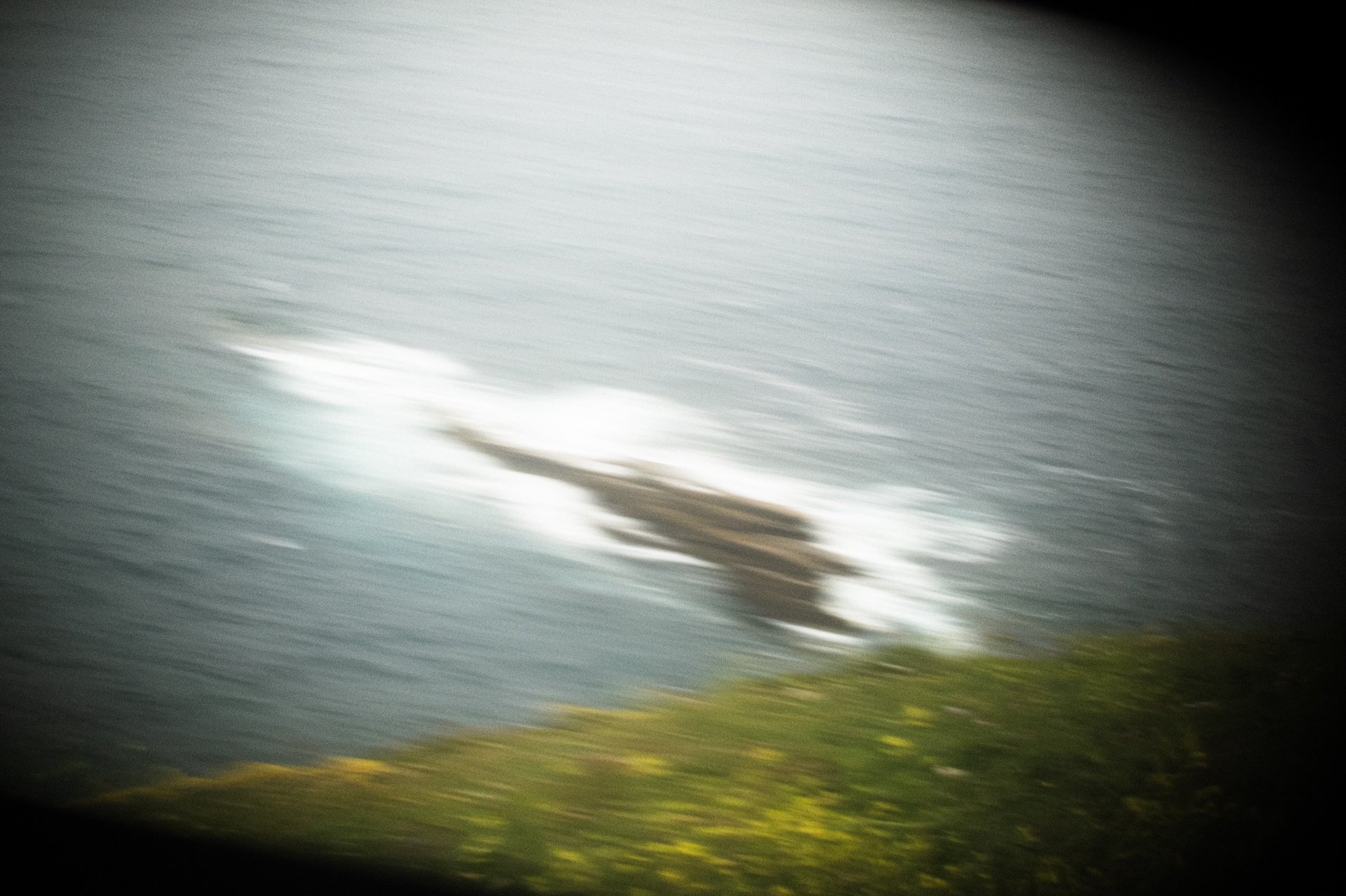 an abstract photo of a curved building with a blue sky in the background