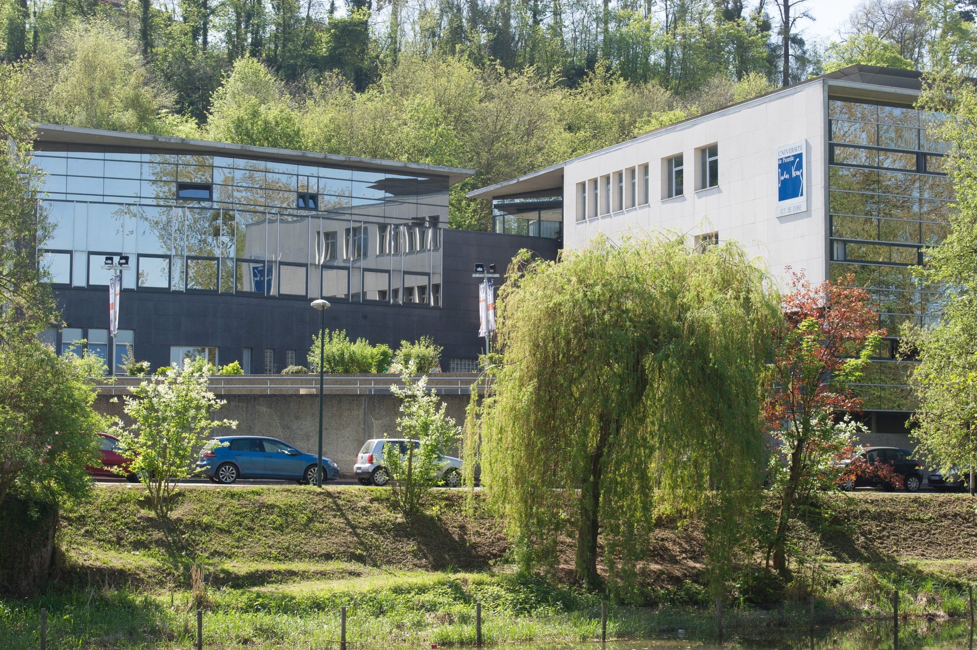 an abstract photo of a curved building with a blue sky in the background