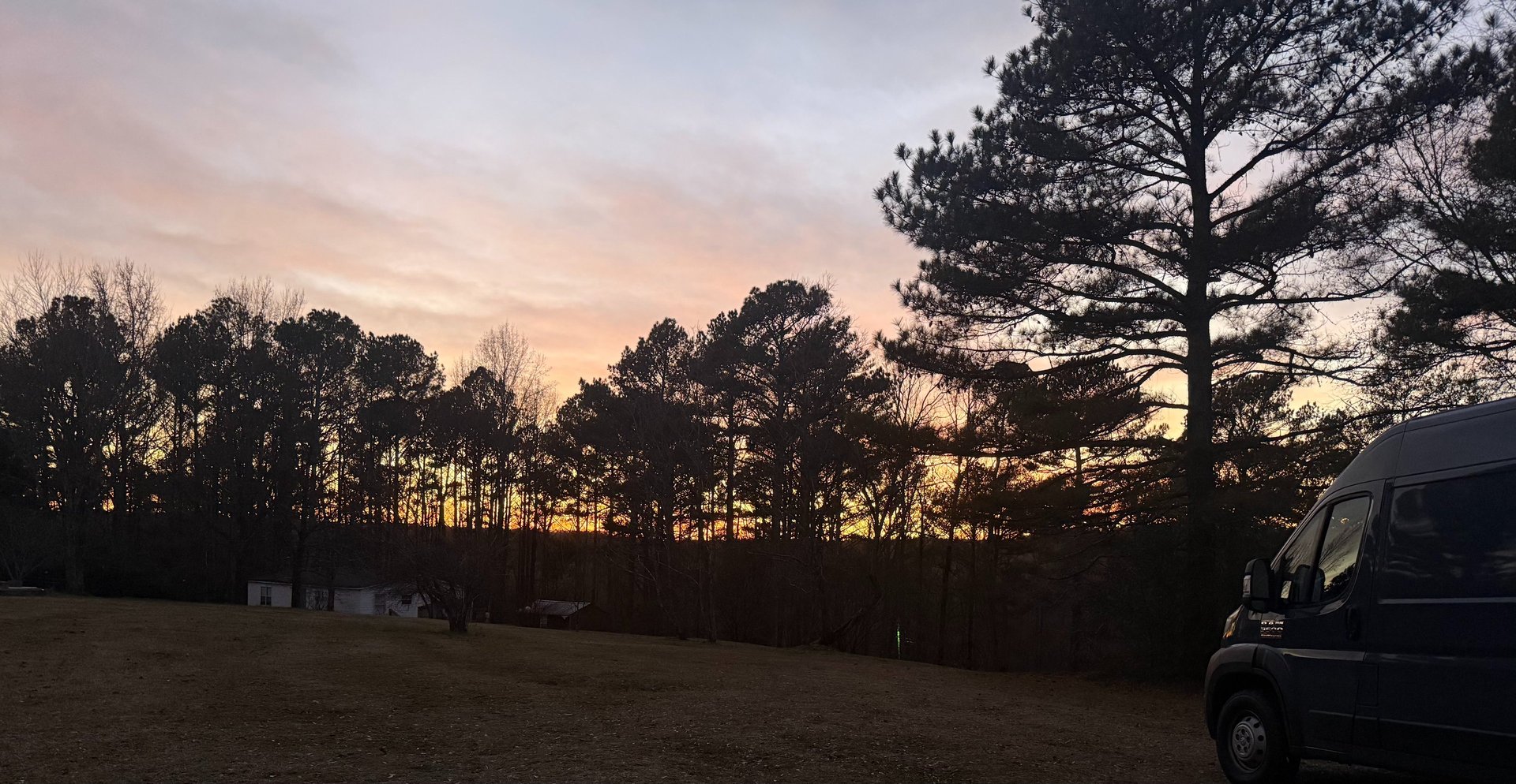 man riding on cruiser motorcycle near Alabama LED signage