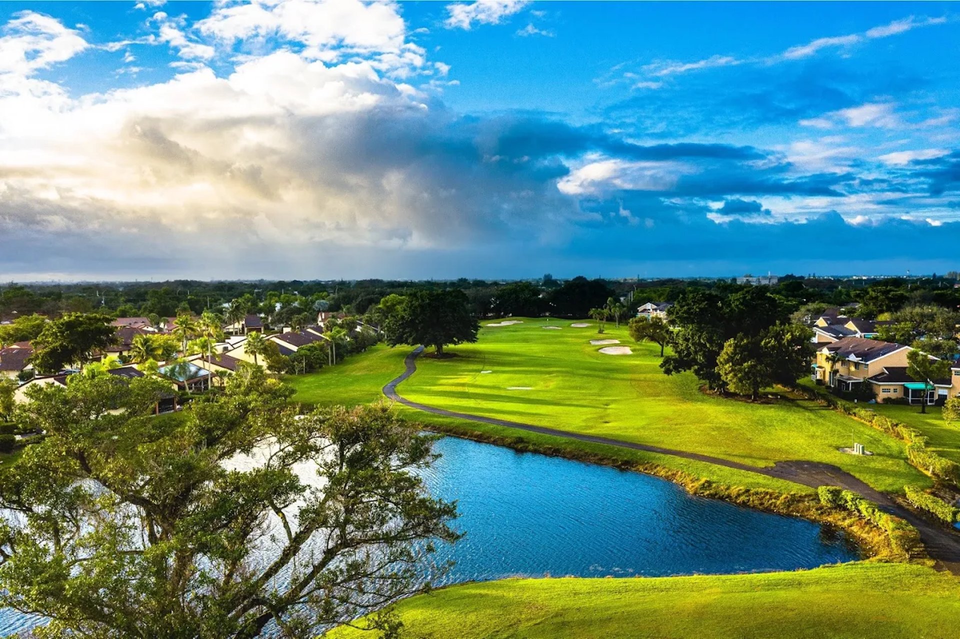 an abstract photo of a curved building with a blue sky in the background