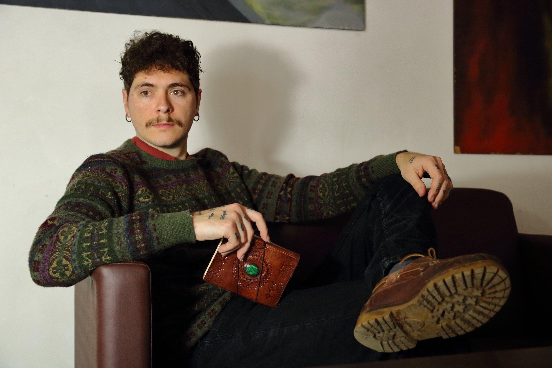 an abstract photo of a curved building with a blue sky in the background