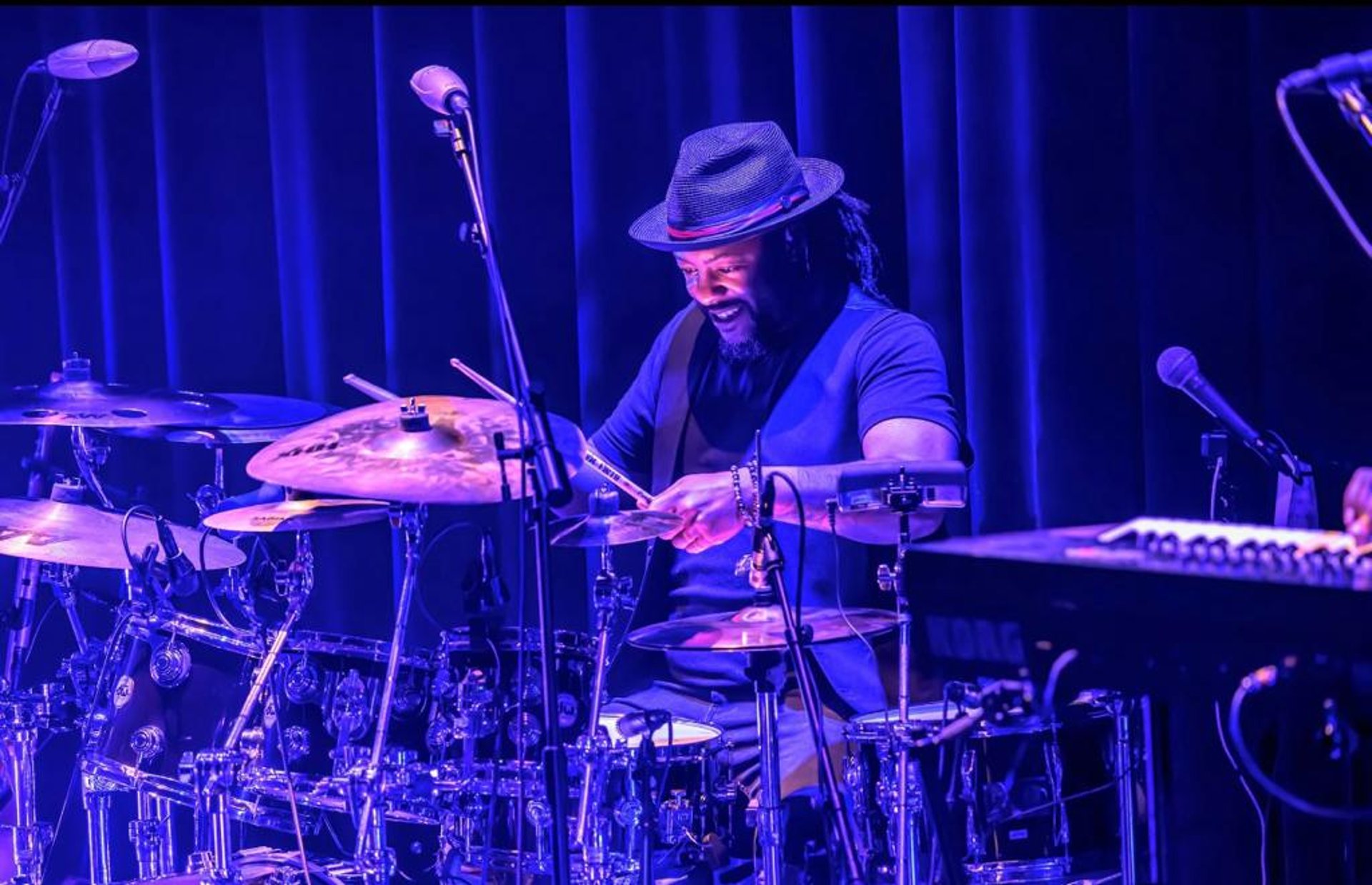an abstract photo of a curved building with a blue sky in the background
